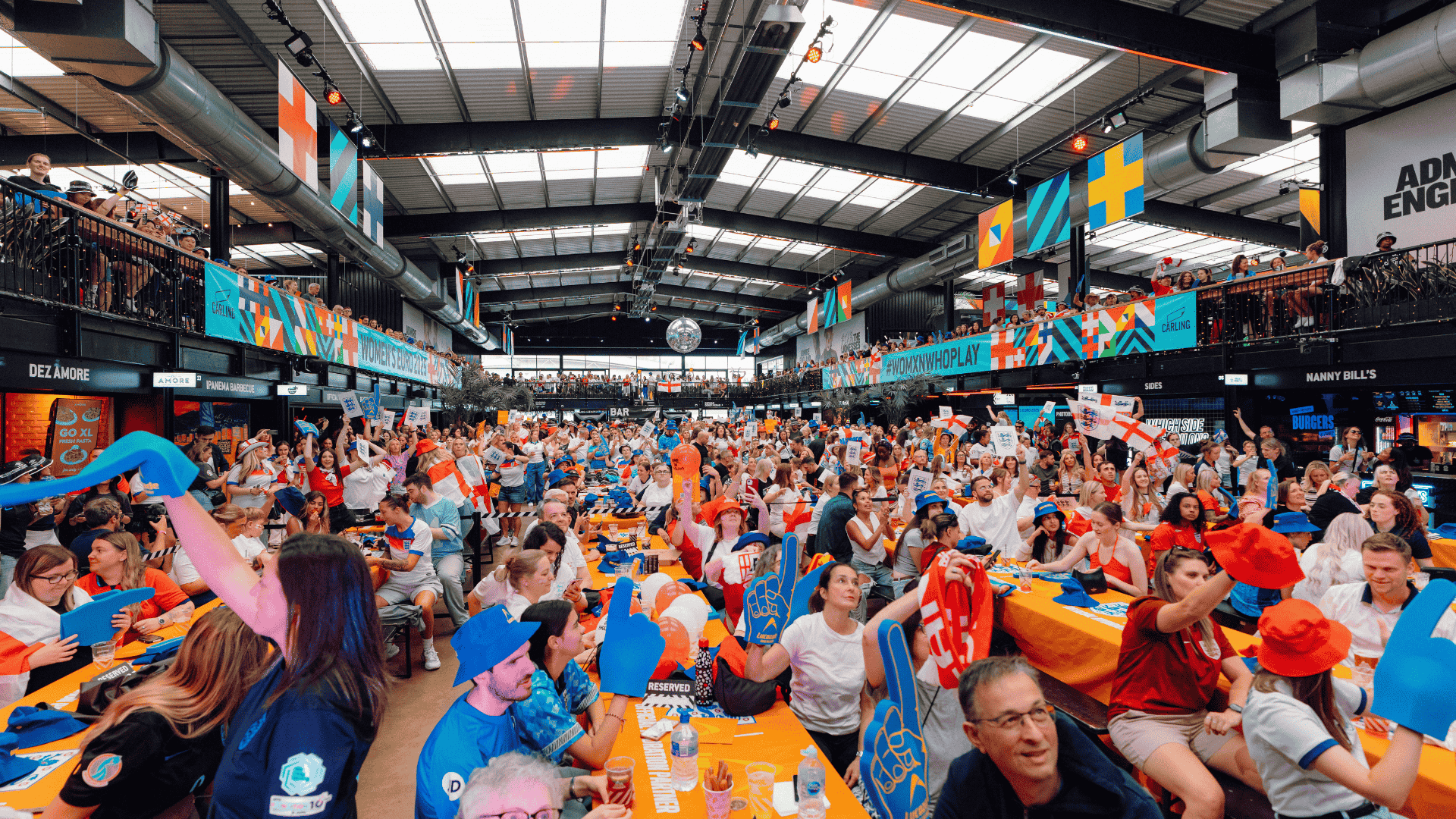 Guests watching football at BOXPARK