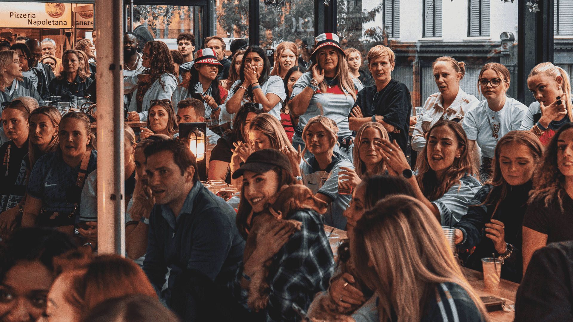 Guests watching football at BOXPARK