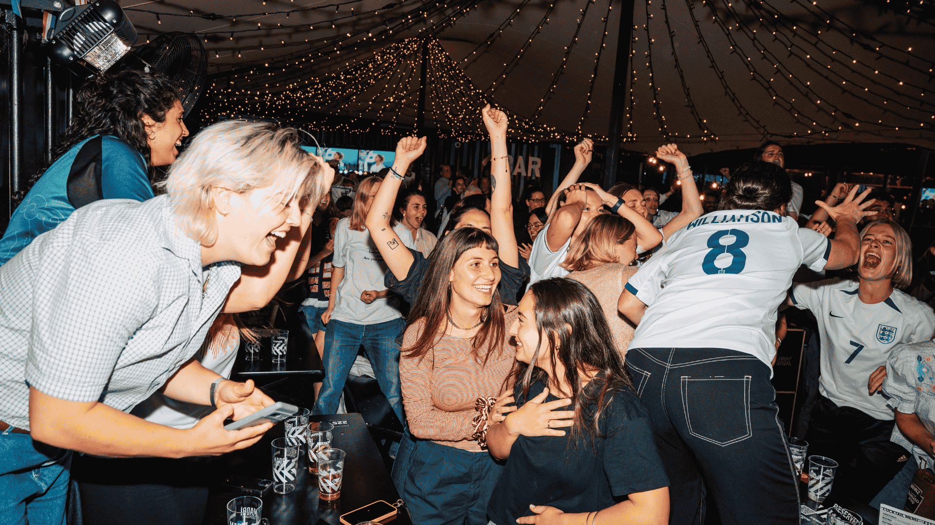 Guests watching football at BOXPARK