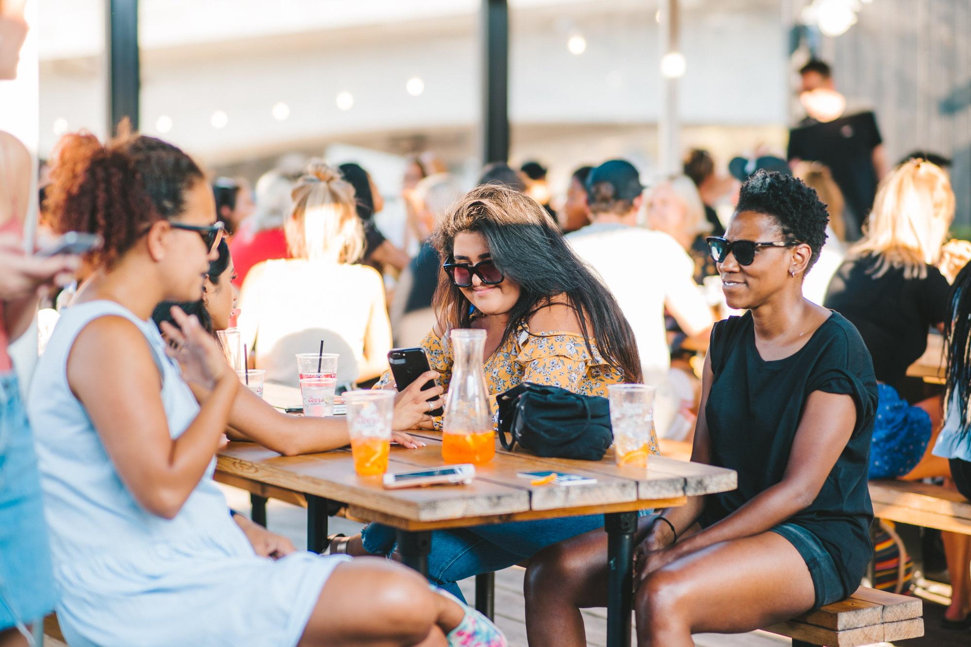 Guests enjoying the sun at Boxpark
