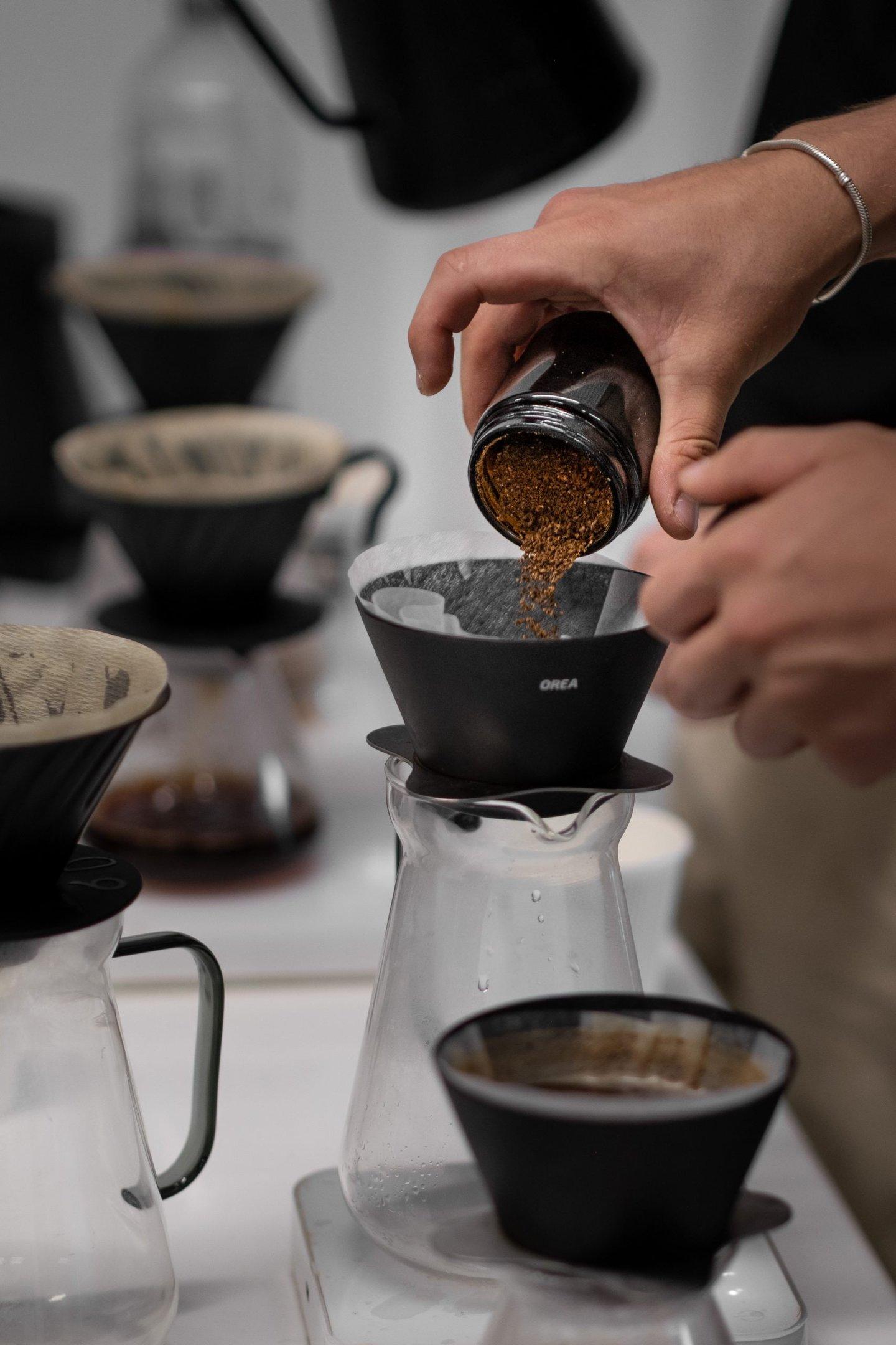 A barista making a coffee at Glass Coffee in Camden