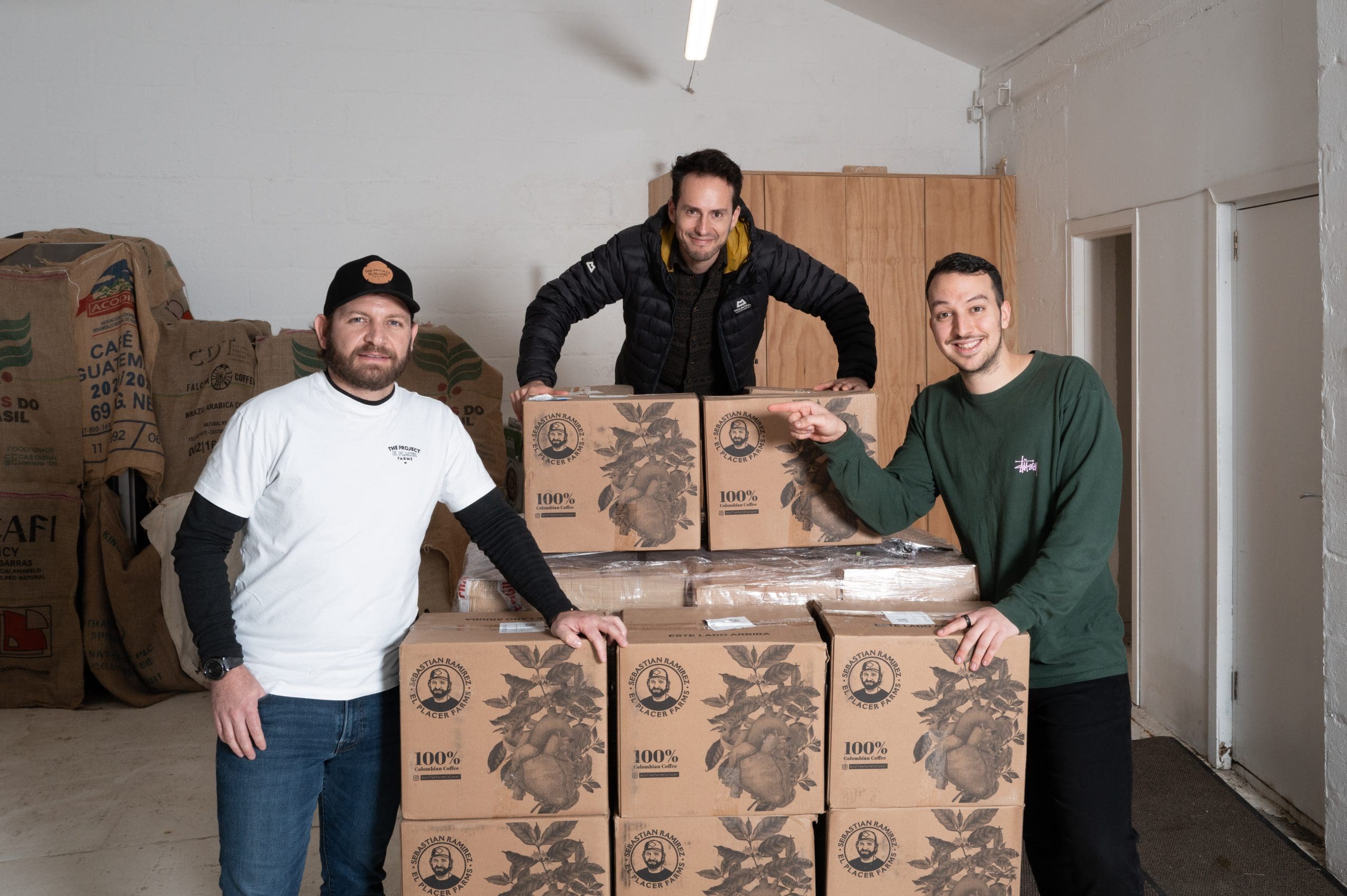 Baristas taking a coffee delivery at Glass Coffee in Camden