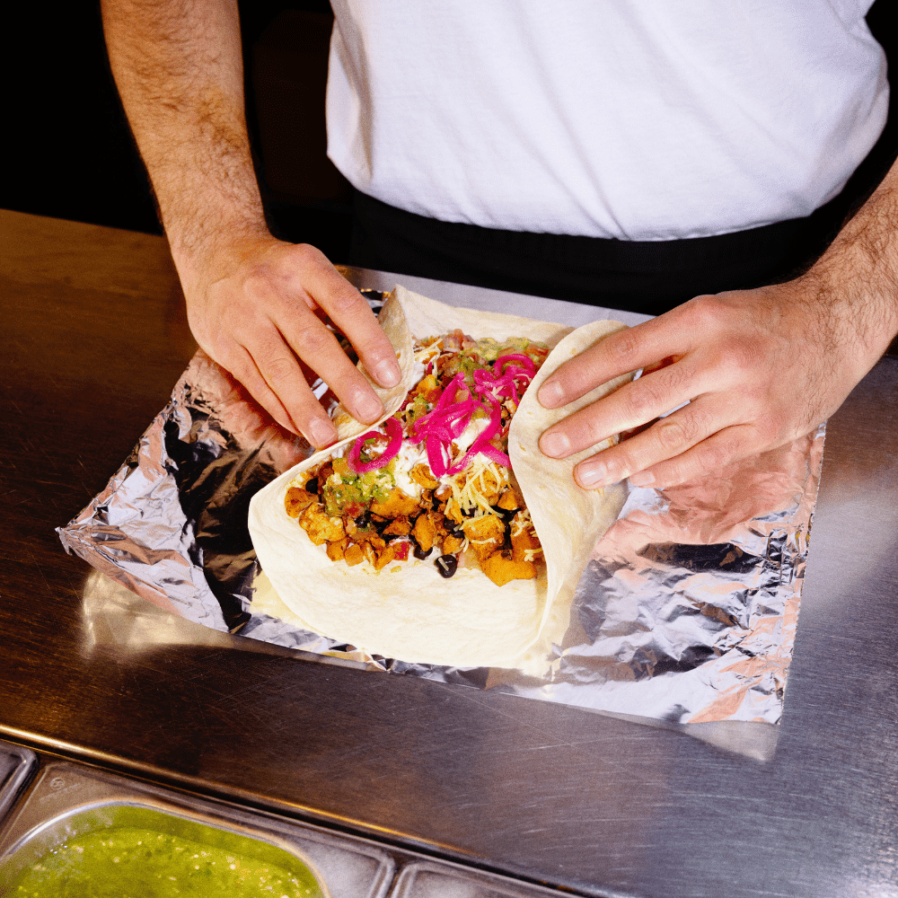 A burrito being prepared at Tortilla