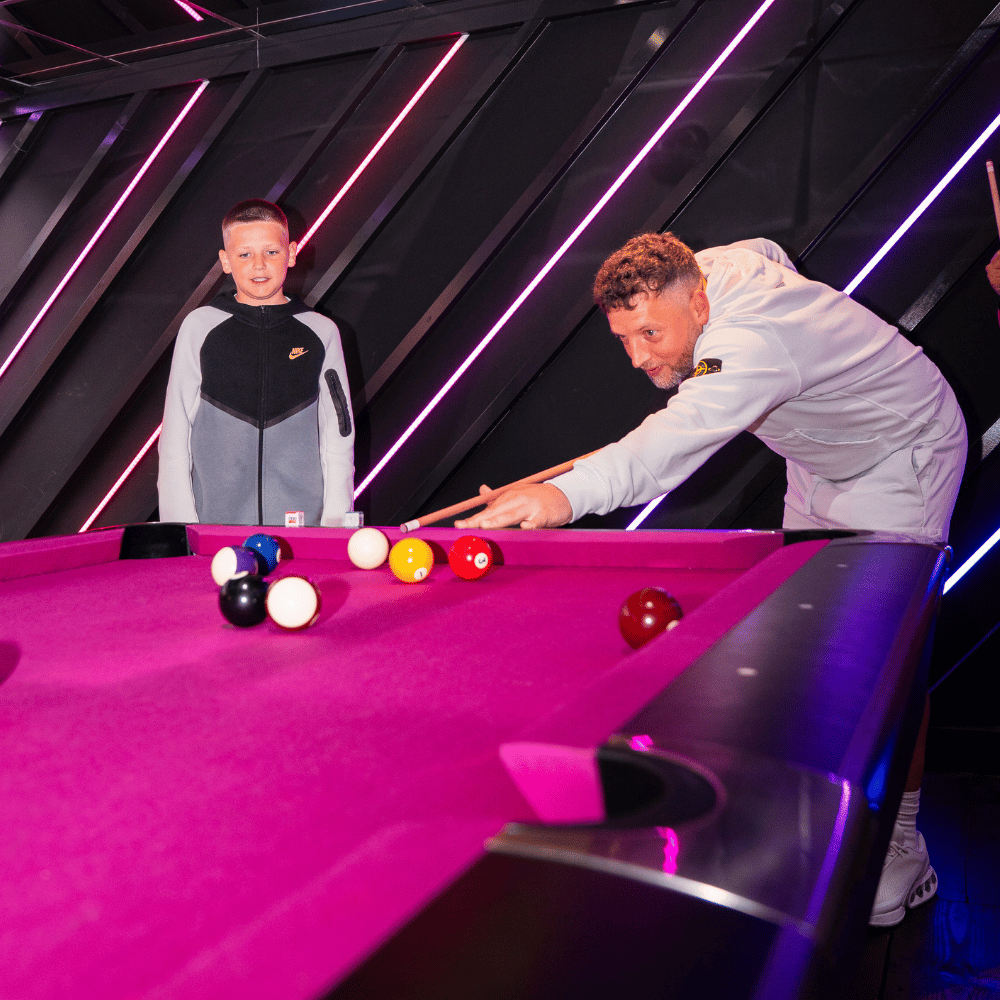 A Father and Son playing Pool at PLAYBOX in Croydon
