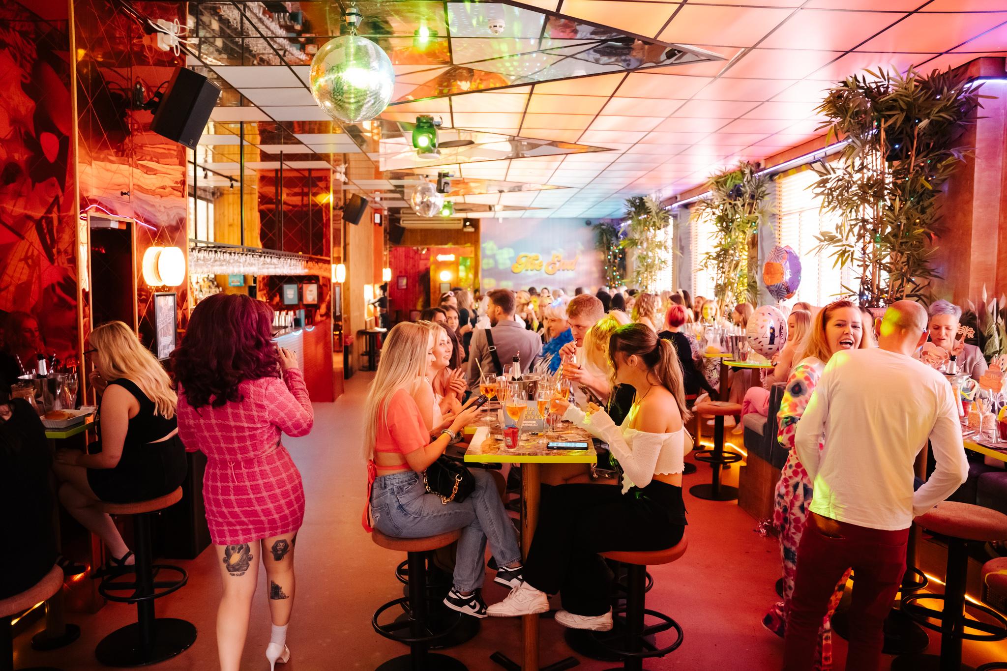 Main Bar at Nikki's with every seat taken by customers