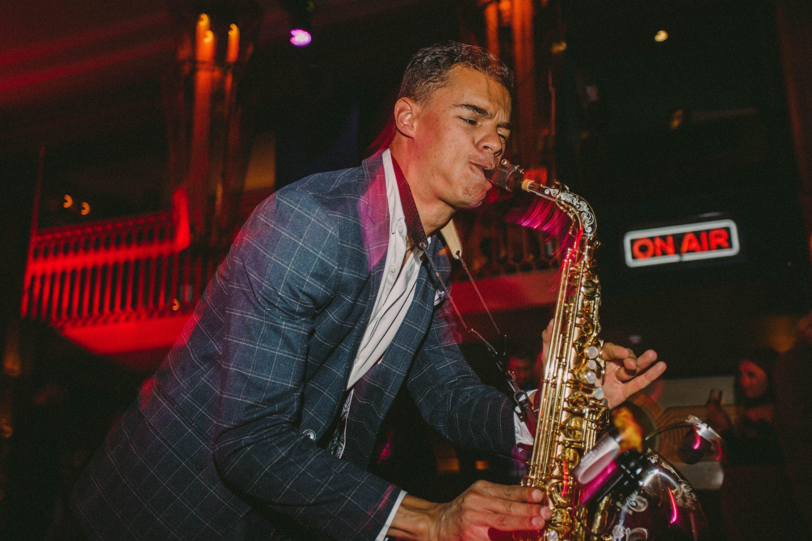 Man playing the Saxophone in a bar