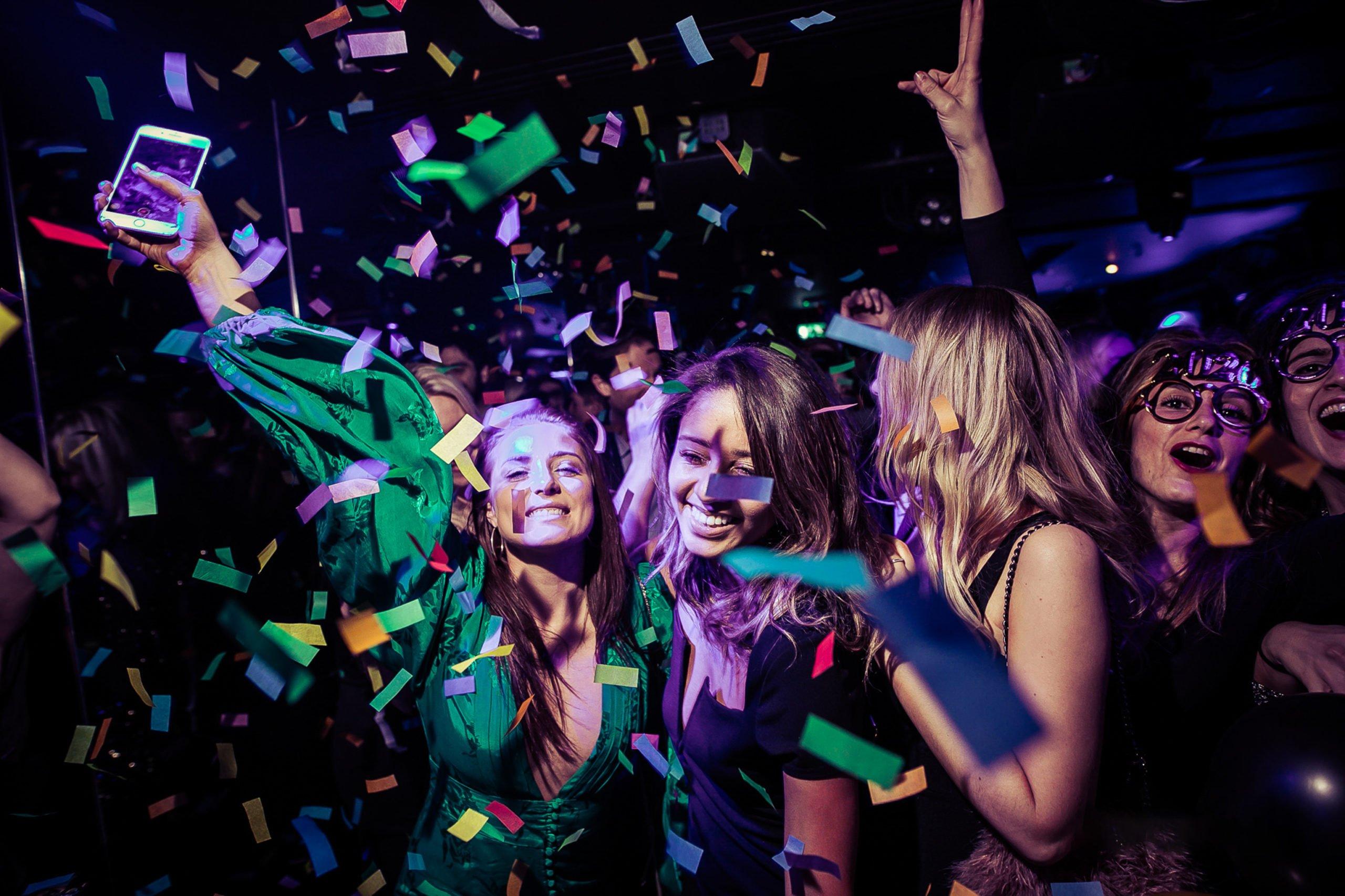 Customers Celebrating at The Piano Works as Confetti Falls on NYE