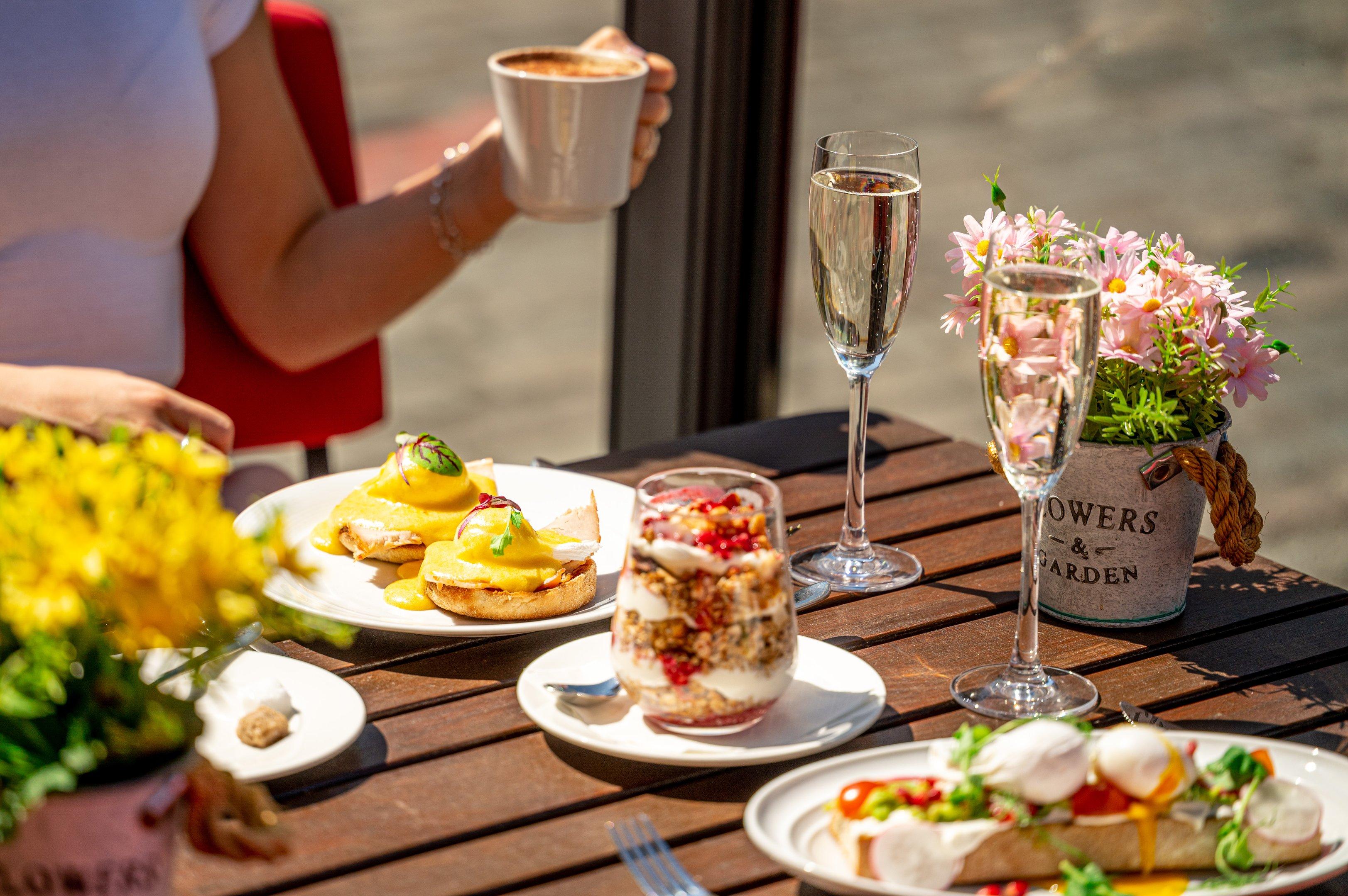 Breakfast dishes on a outdoor dining table in Covent Garden