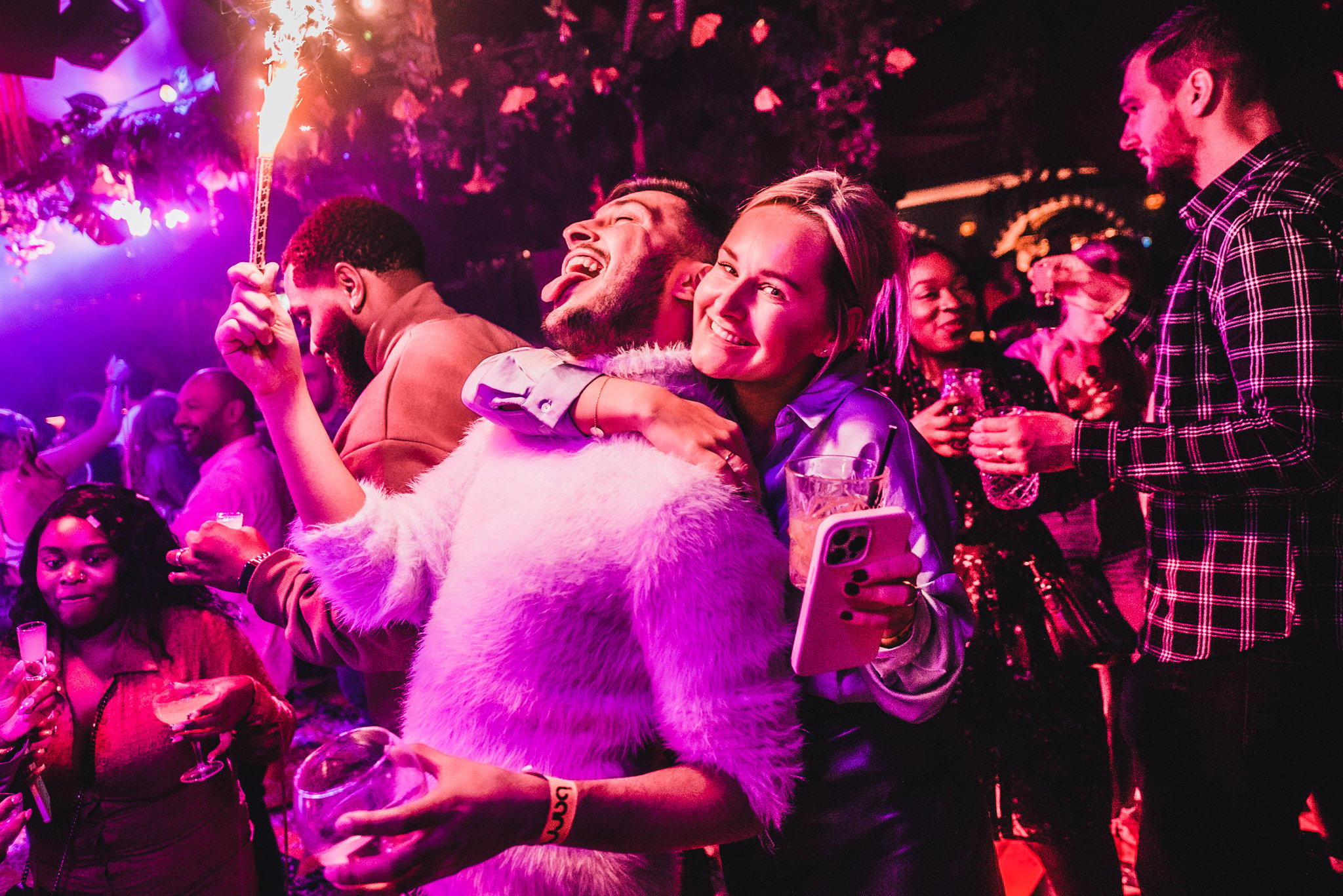 Couple partying with Sparklers at Barrio Bars