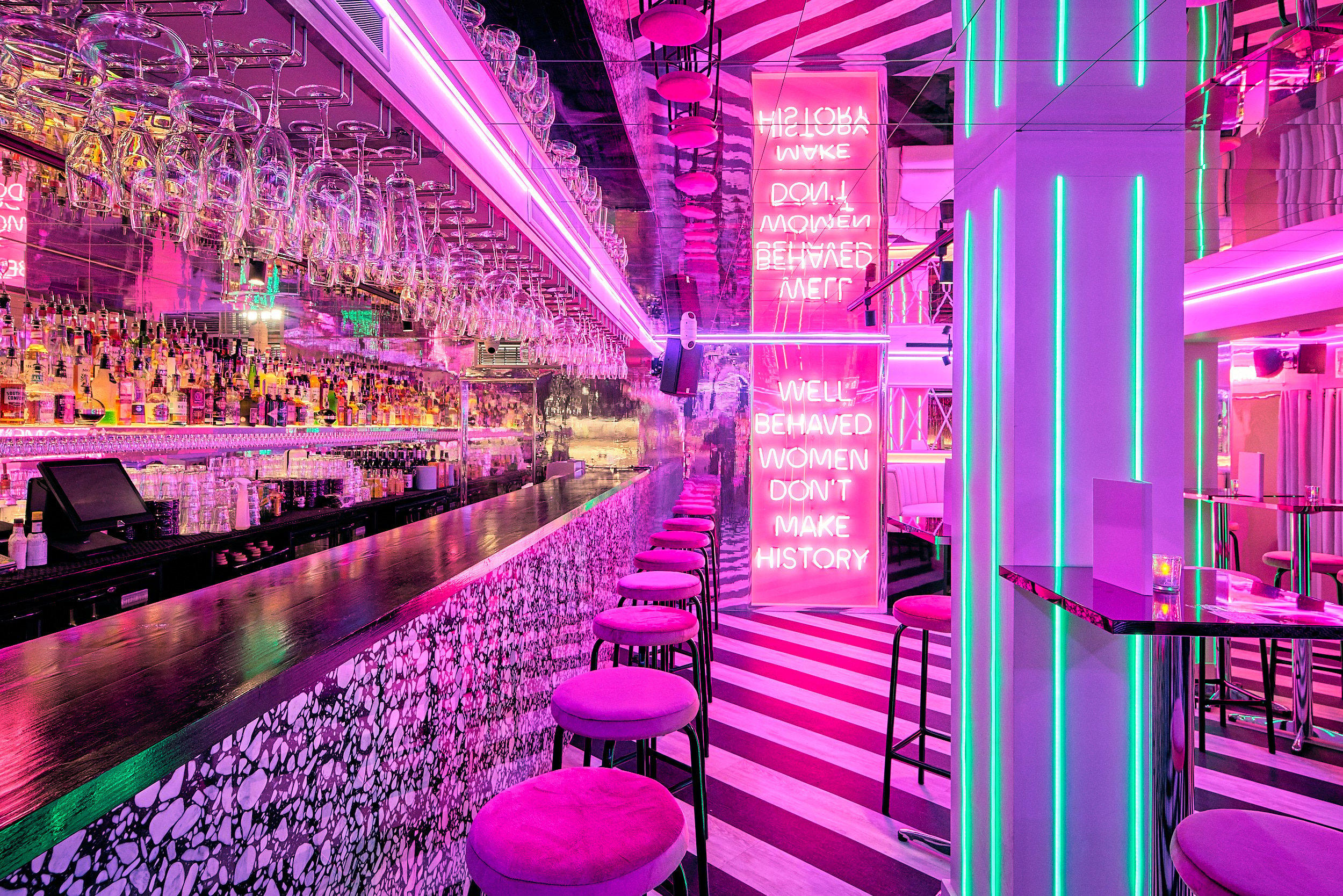 The main bar area of Tonight Josephine Birmingham with a pink neon sign