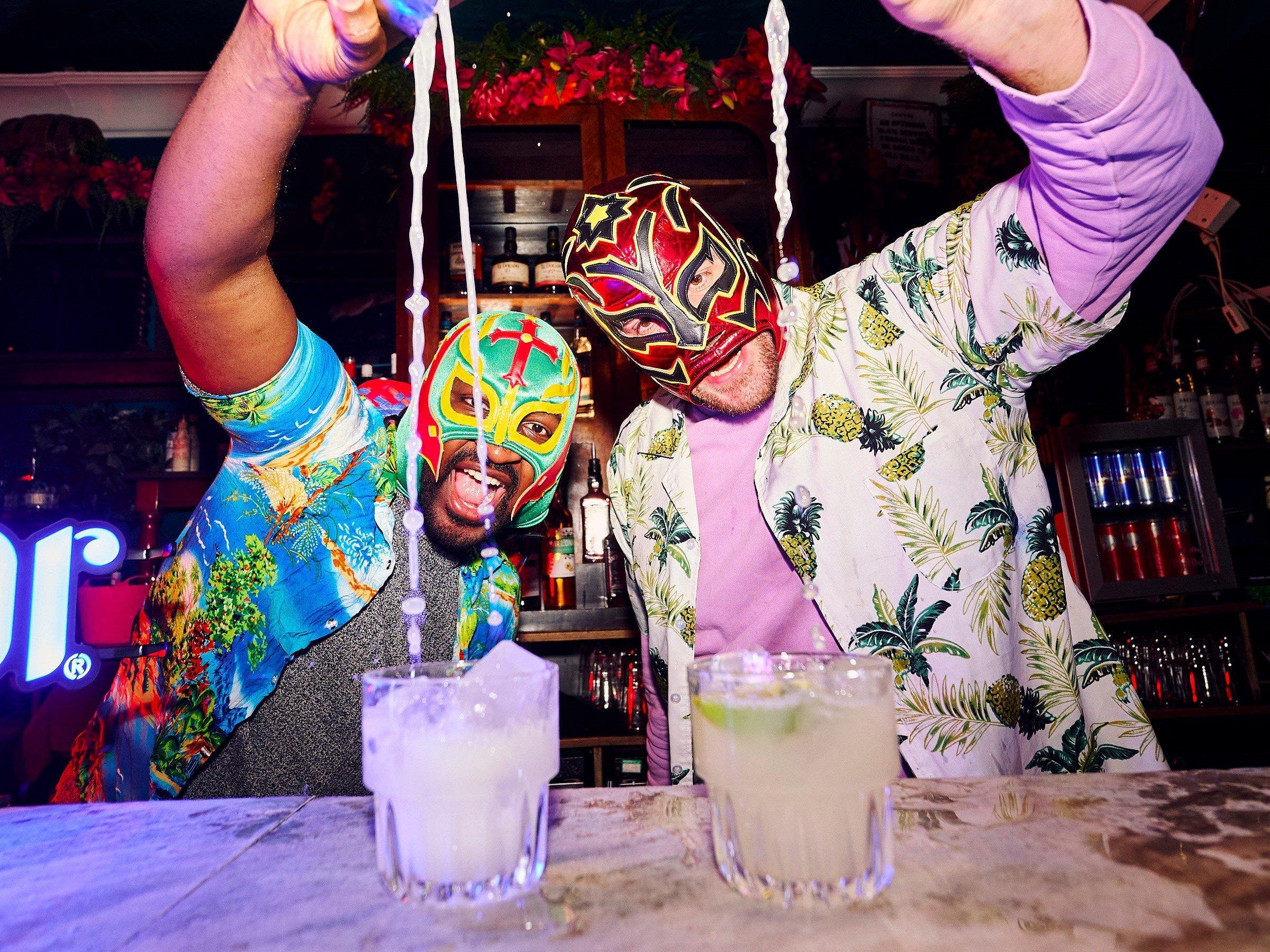 Bartenders serving up Tommy's Margaritas in Barrio Bar