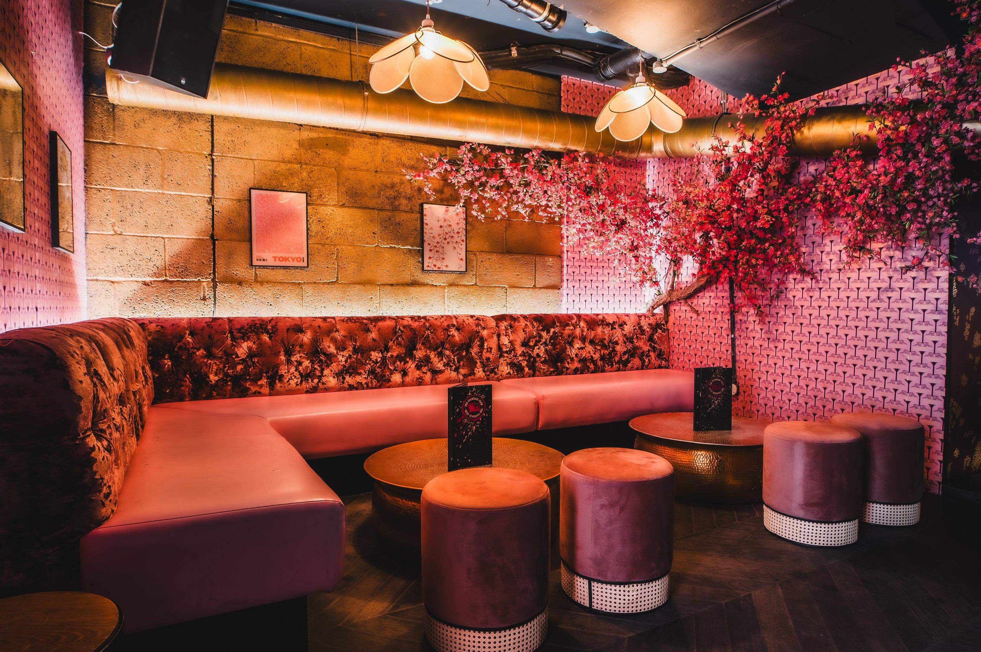 Bar area with pink blossoms and floral seating