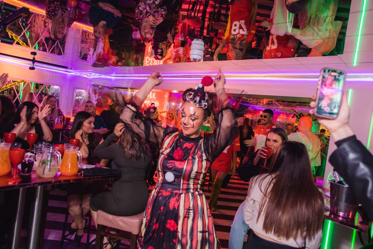 A woman in fancy dress dancing in a Tonight Josephine bar