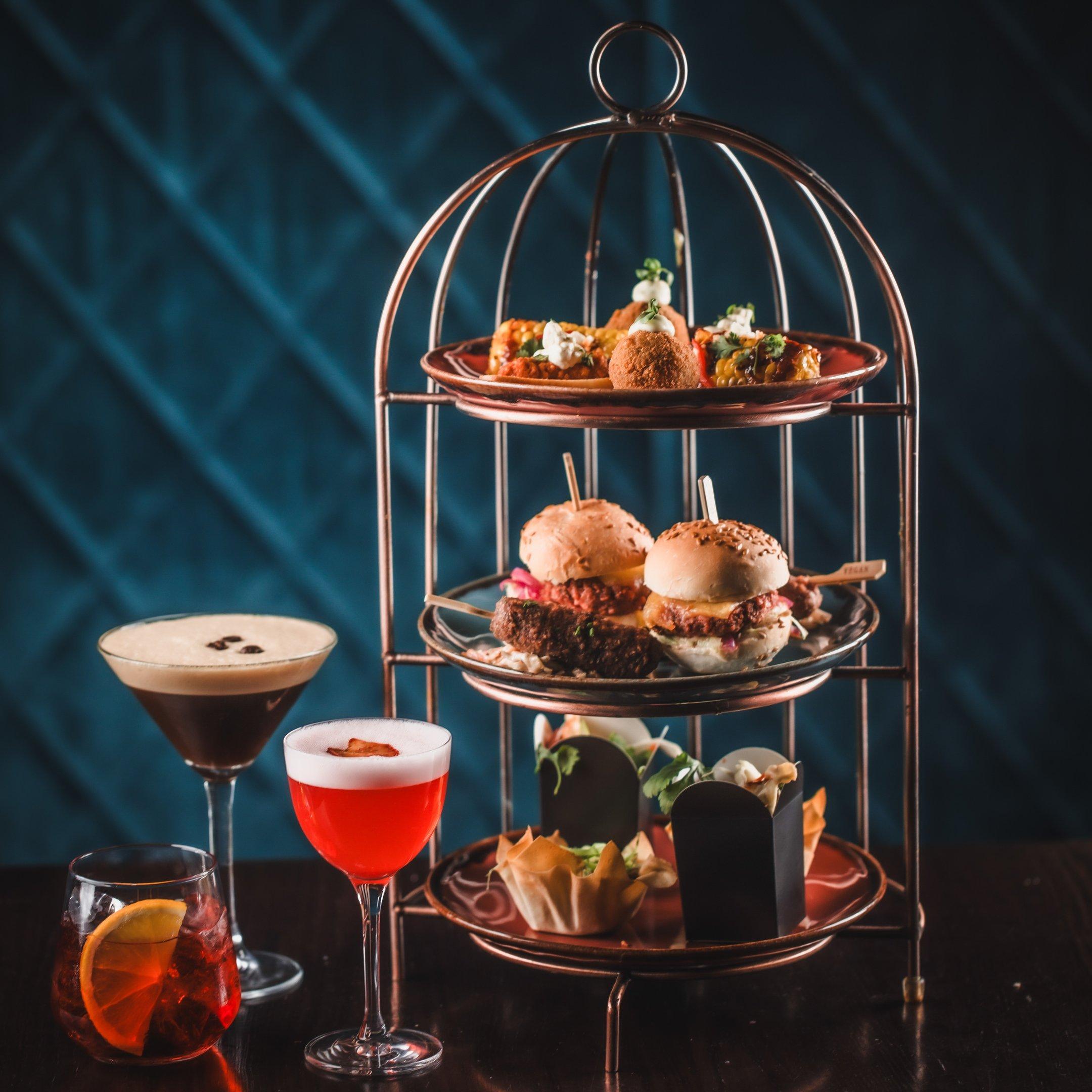 A birdcage sharer with cocktails at Dirty Martini