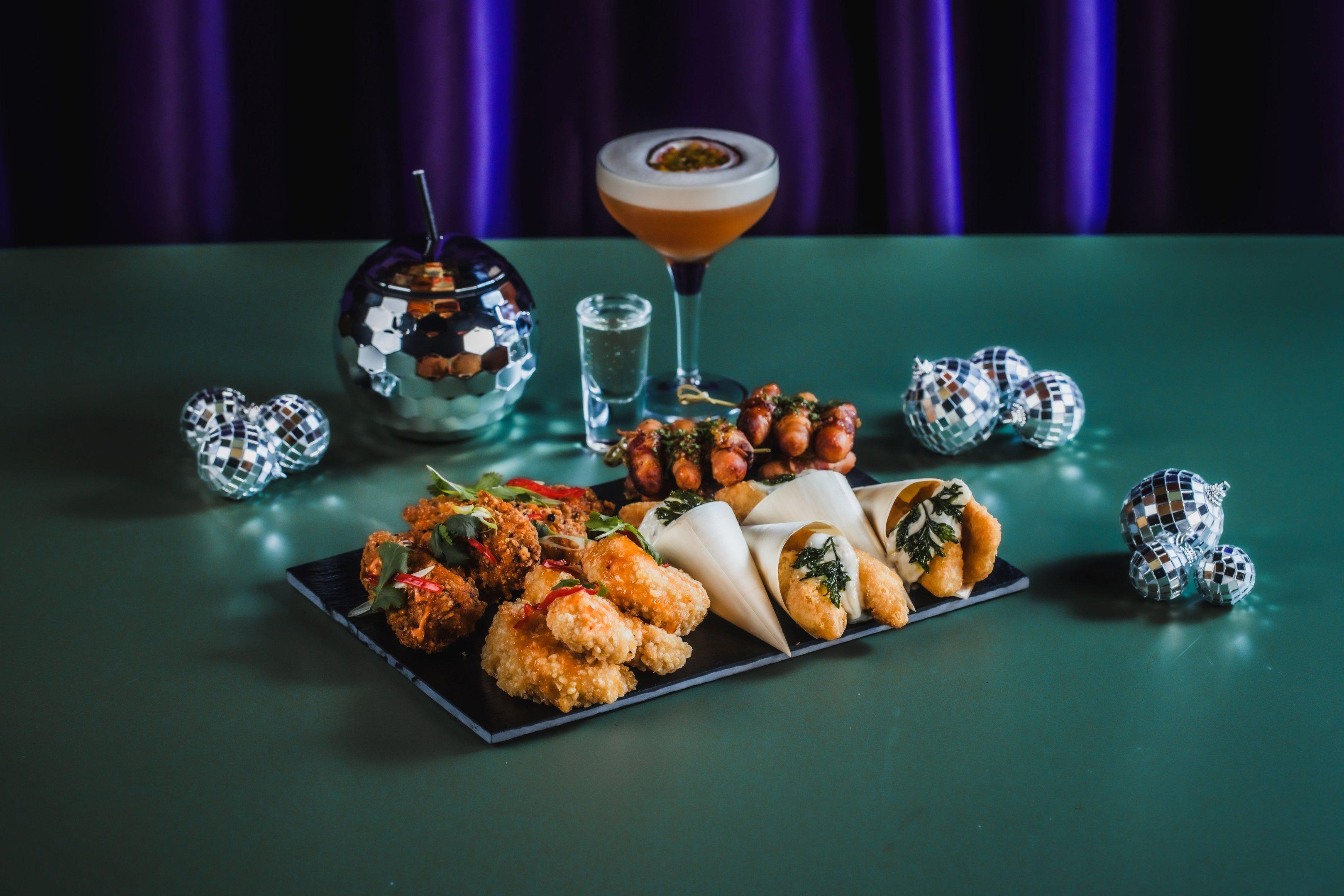 Image of a Christmas food platter and a Pornstar Martini at Blame Gloria