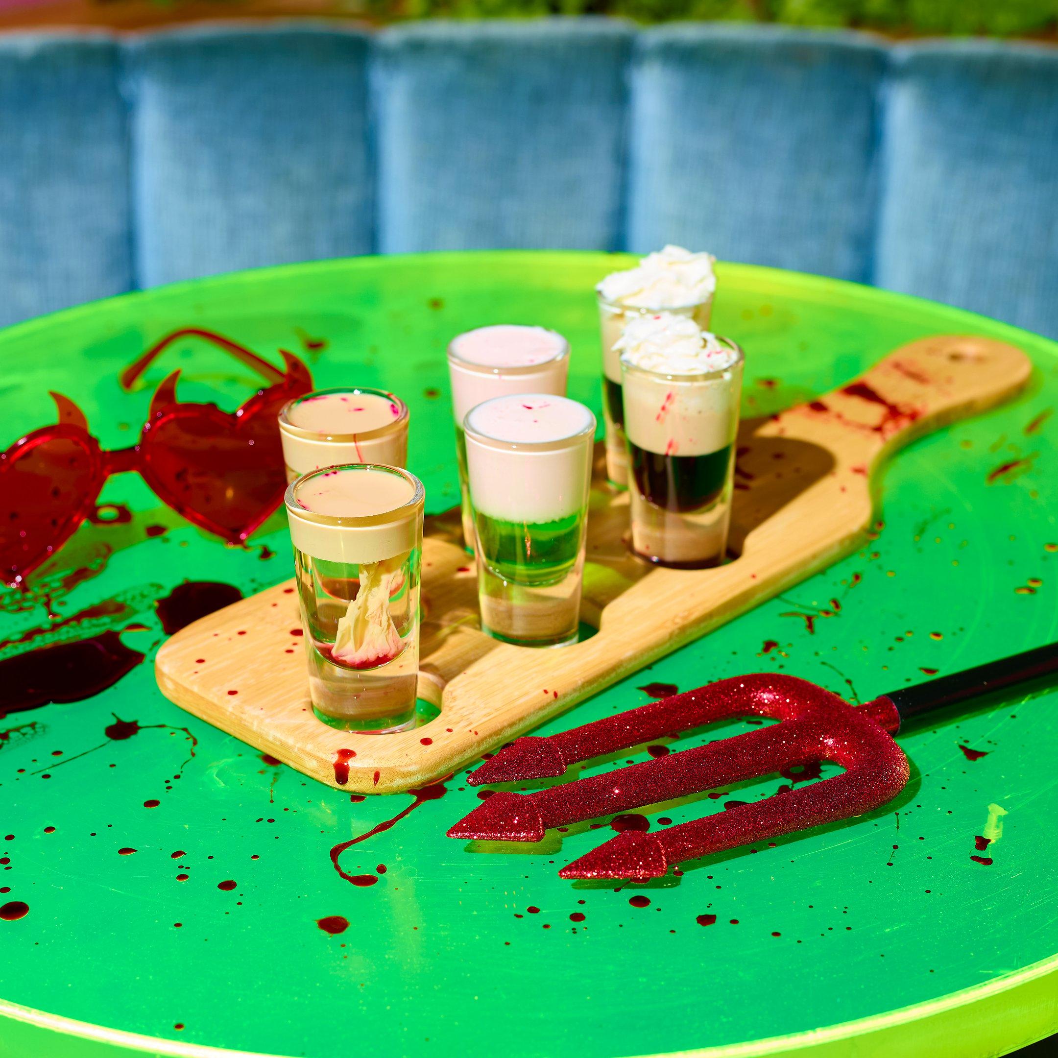 An image of a shot paddle with 6 halloween shots at Nikki's