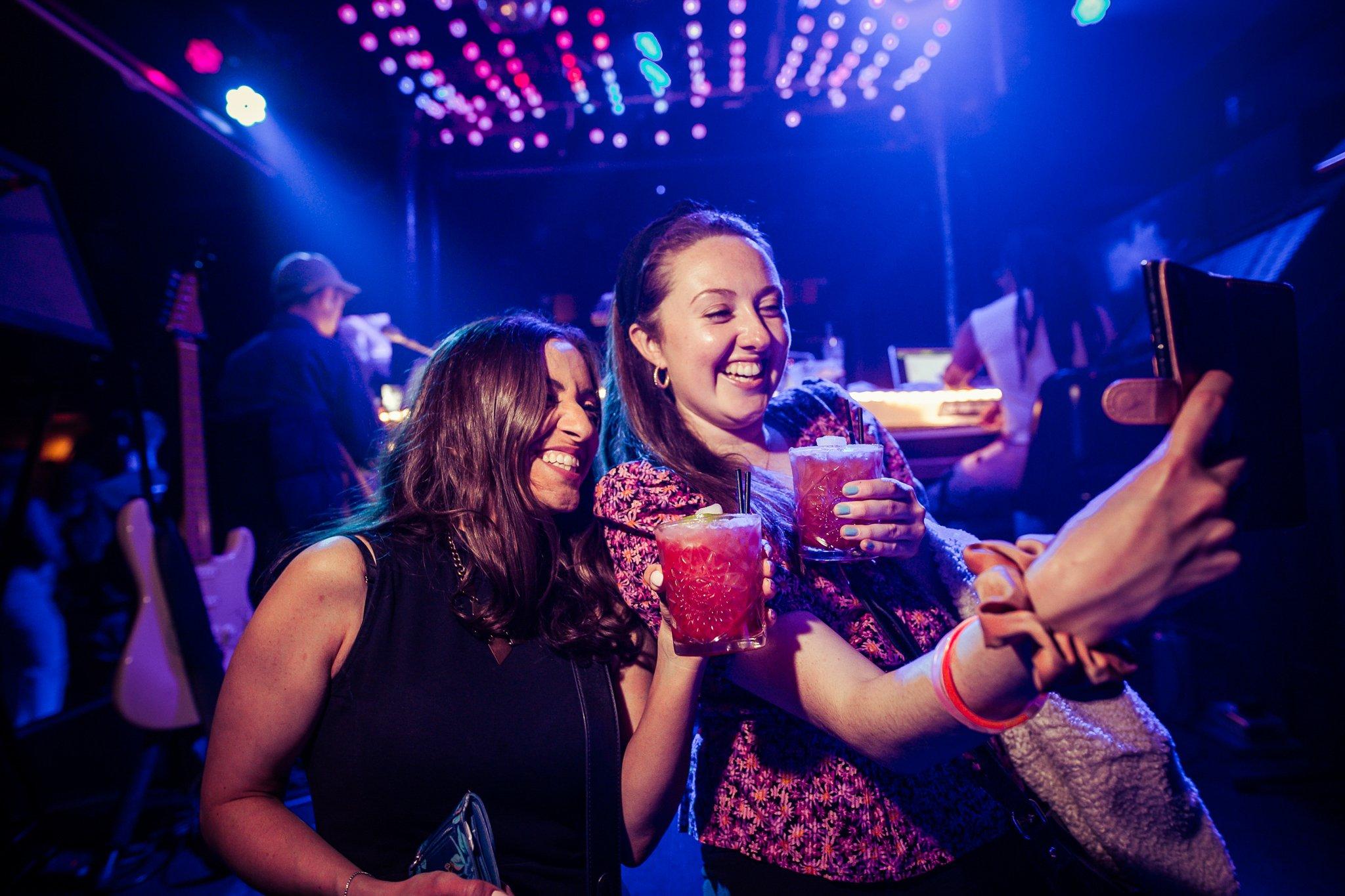 Two female customers enjoying drinks in The Piano Works