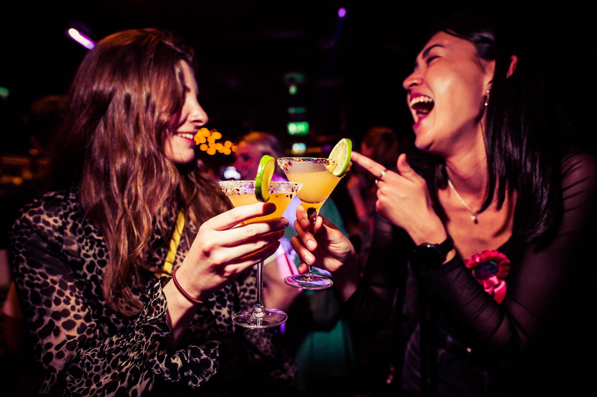 Two female customers enjoying cocktails in The Piano Works 