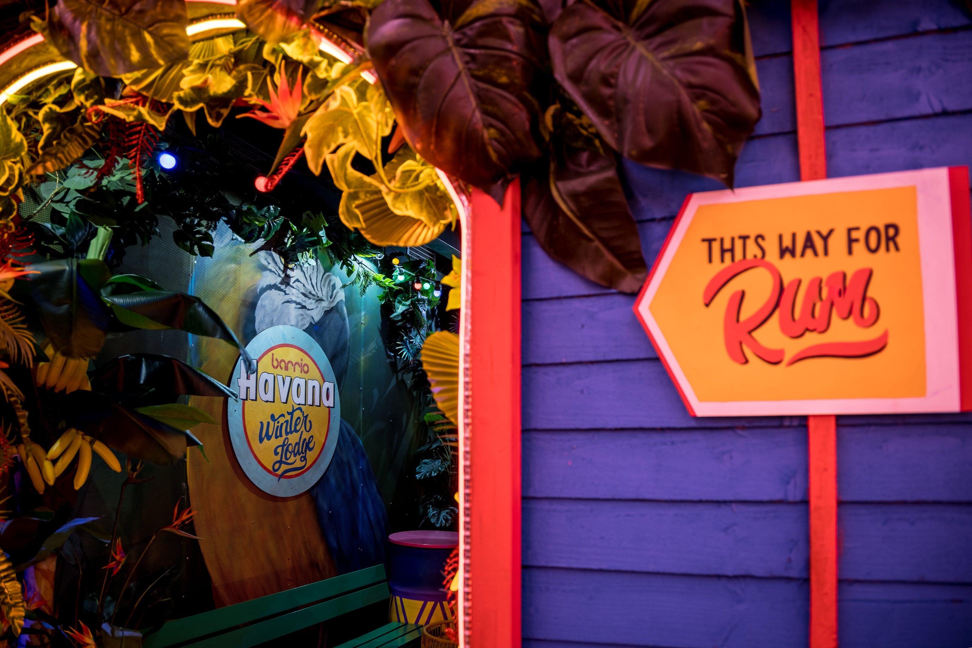 This way for Rum sign in the Barrio Shoreditch winter lodge