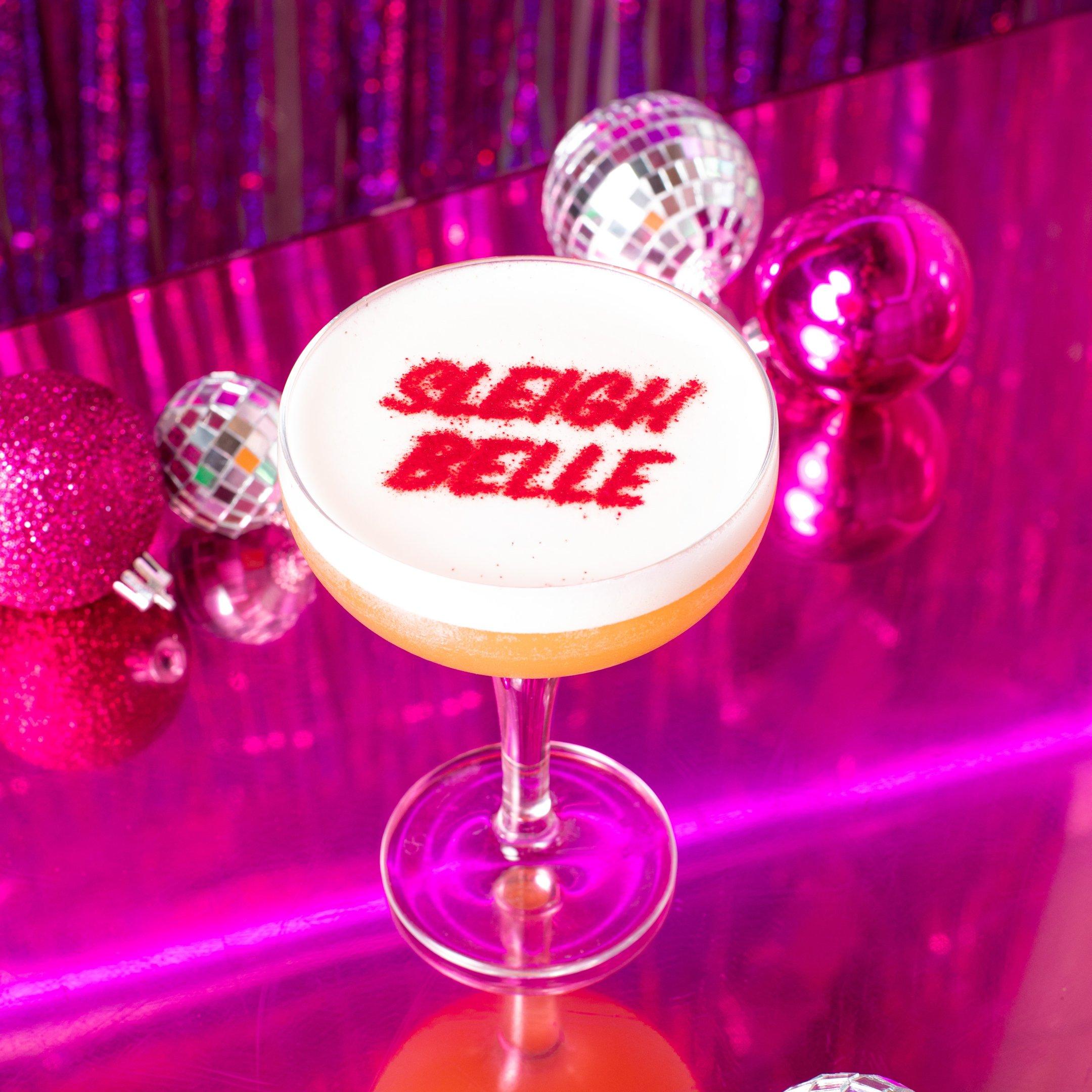 Cocktail with 'Sleigh Belle' in edible glitter on the top 