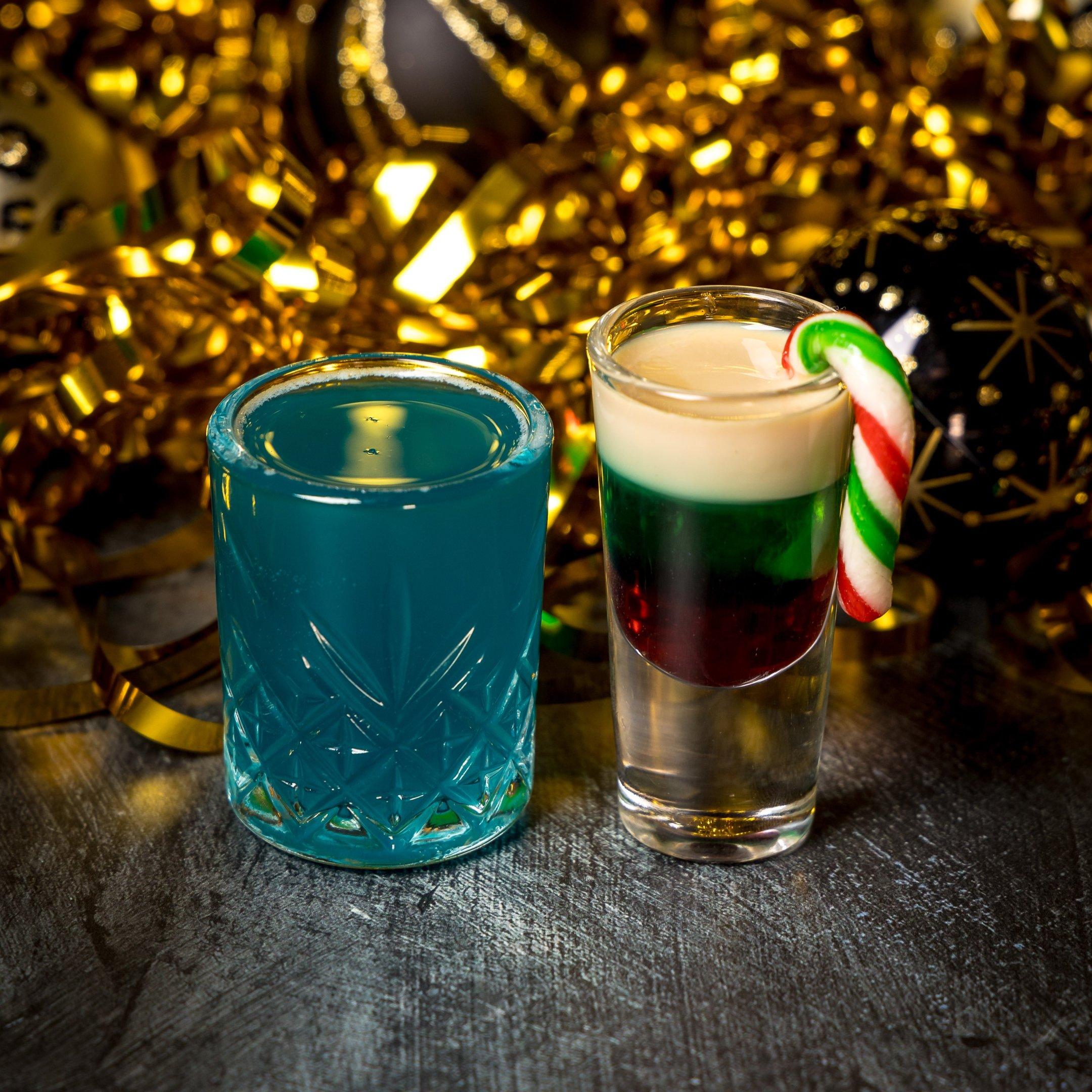 A blue shot and a multicoloured shot with a small candy cane