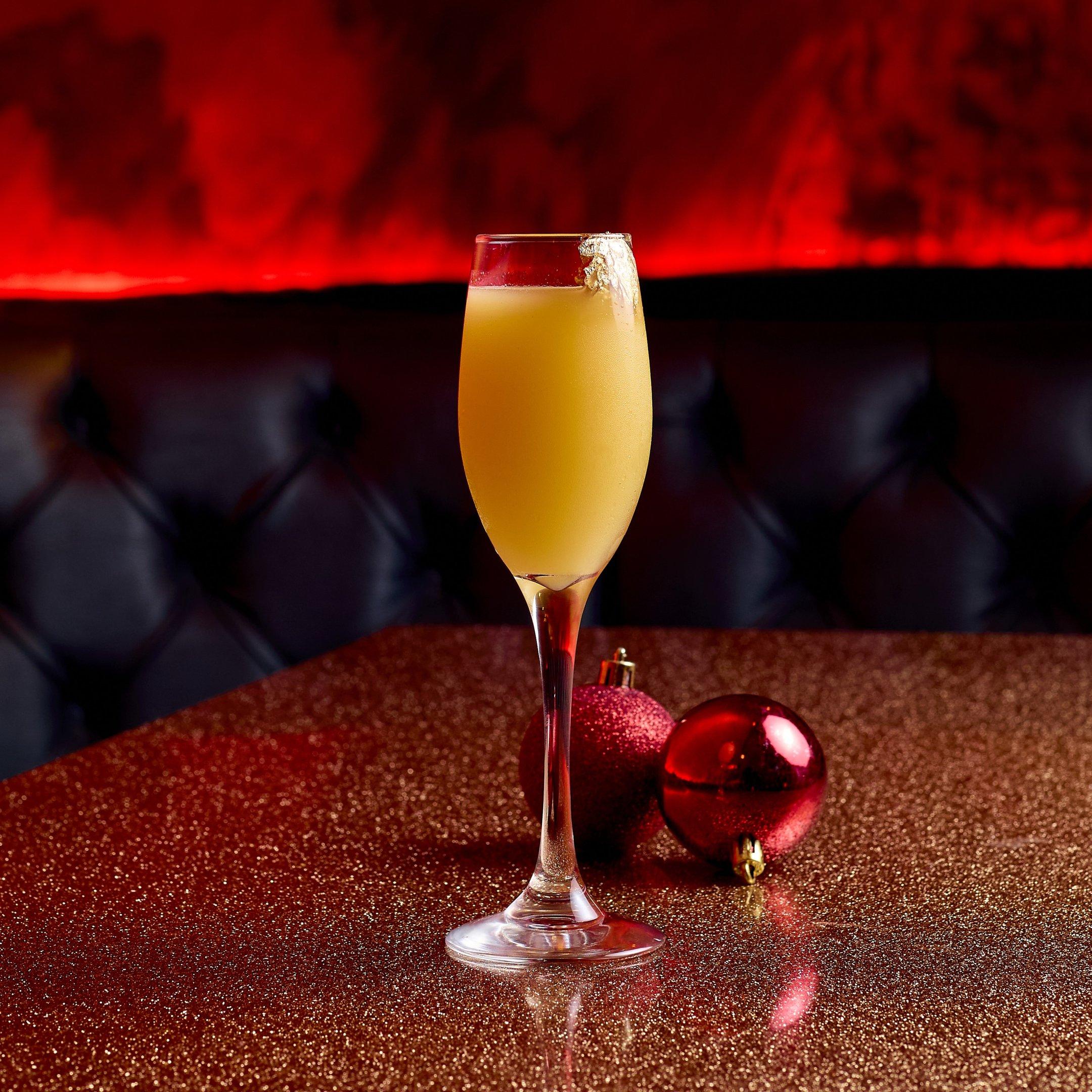 A festive Bucksfizz cocktail on a table in The Escapologist