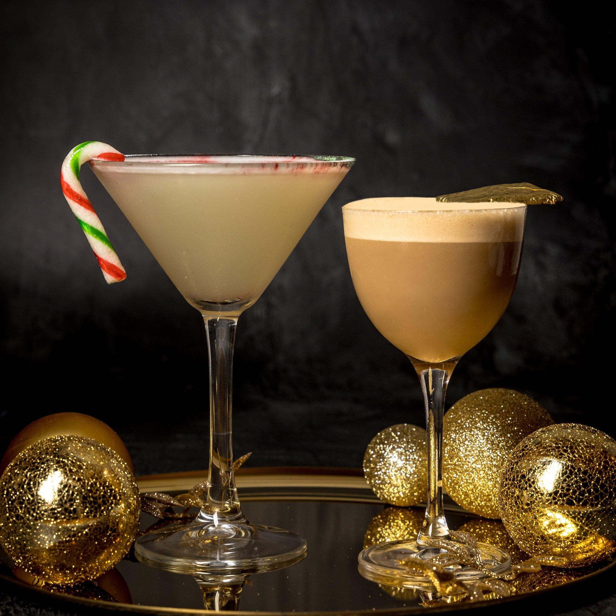 Two Christmas cocktails on a gold tray