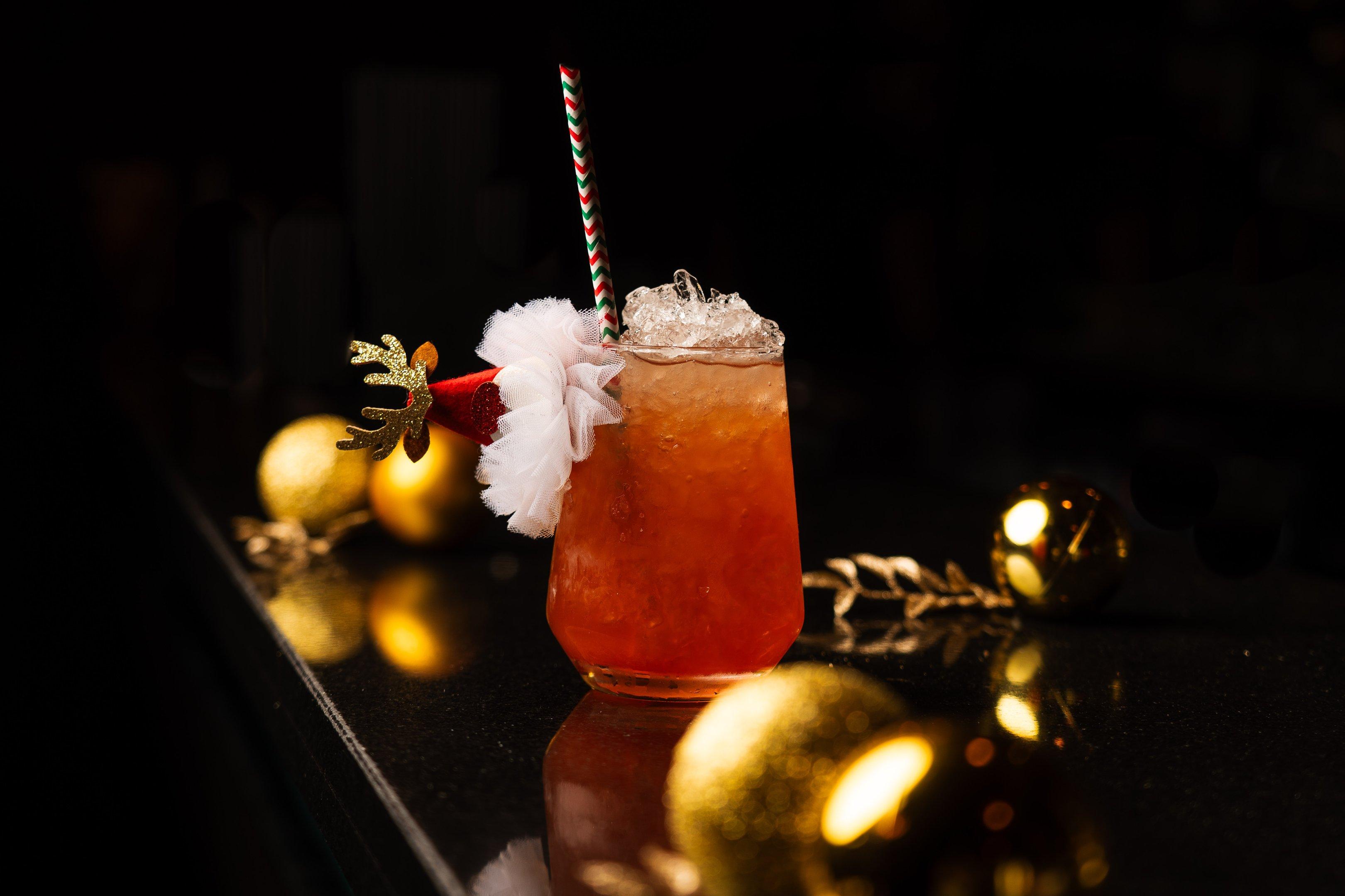 Christmas cocktail with a Santa Hat garnish