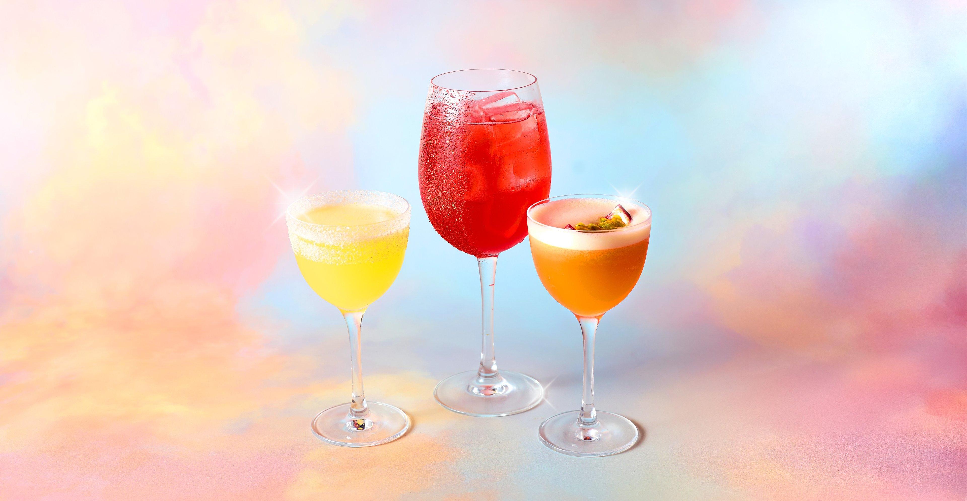 Three Tonight Josephine mocktails on a cloud background