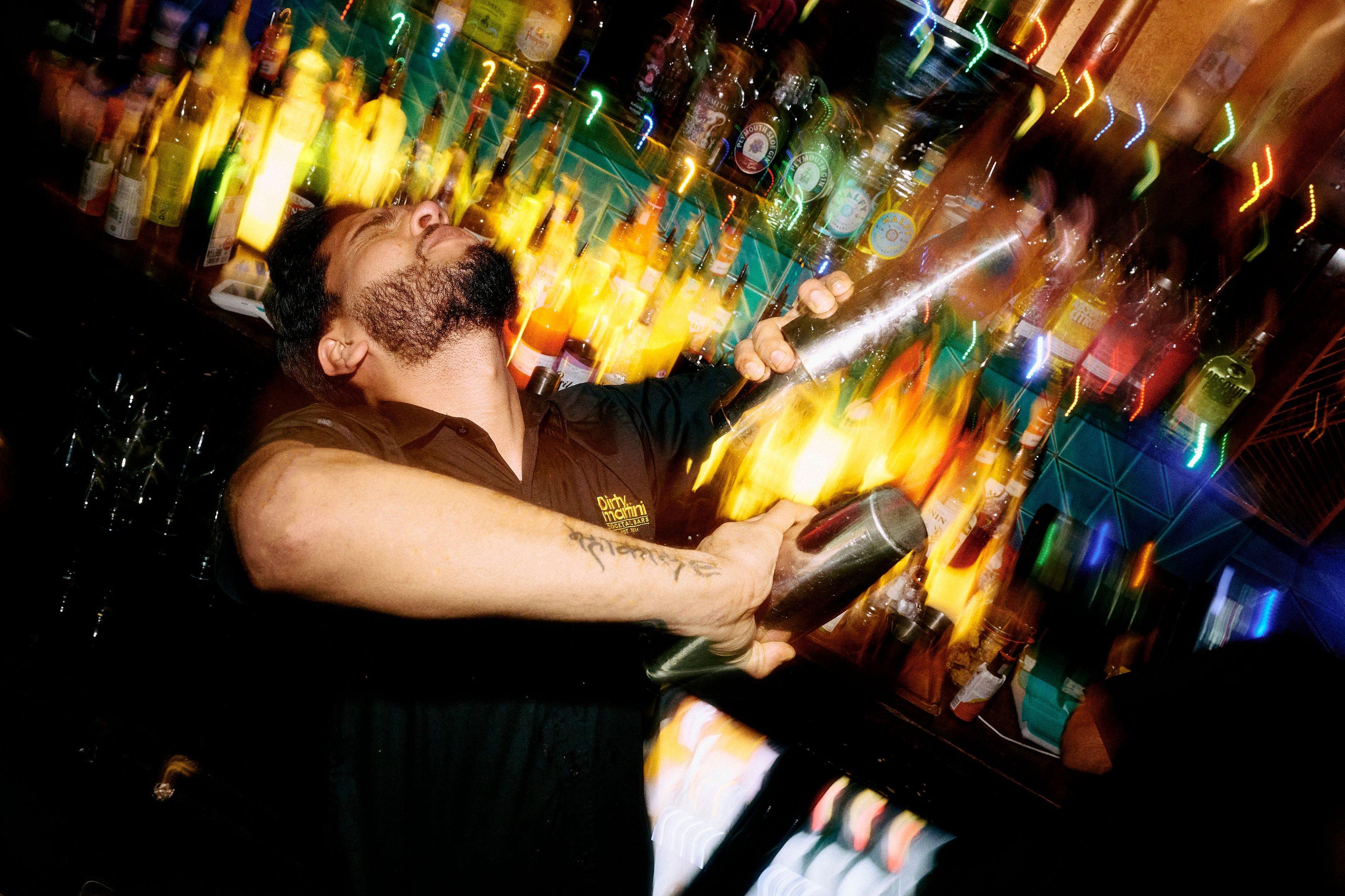 Bartender shaking cocktails in Dirty Martini