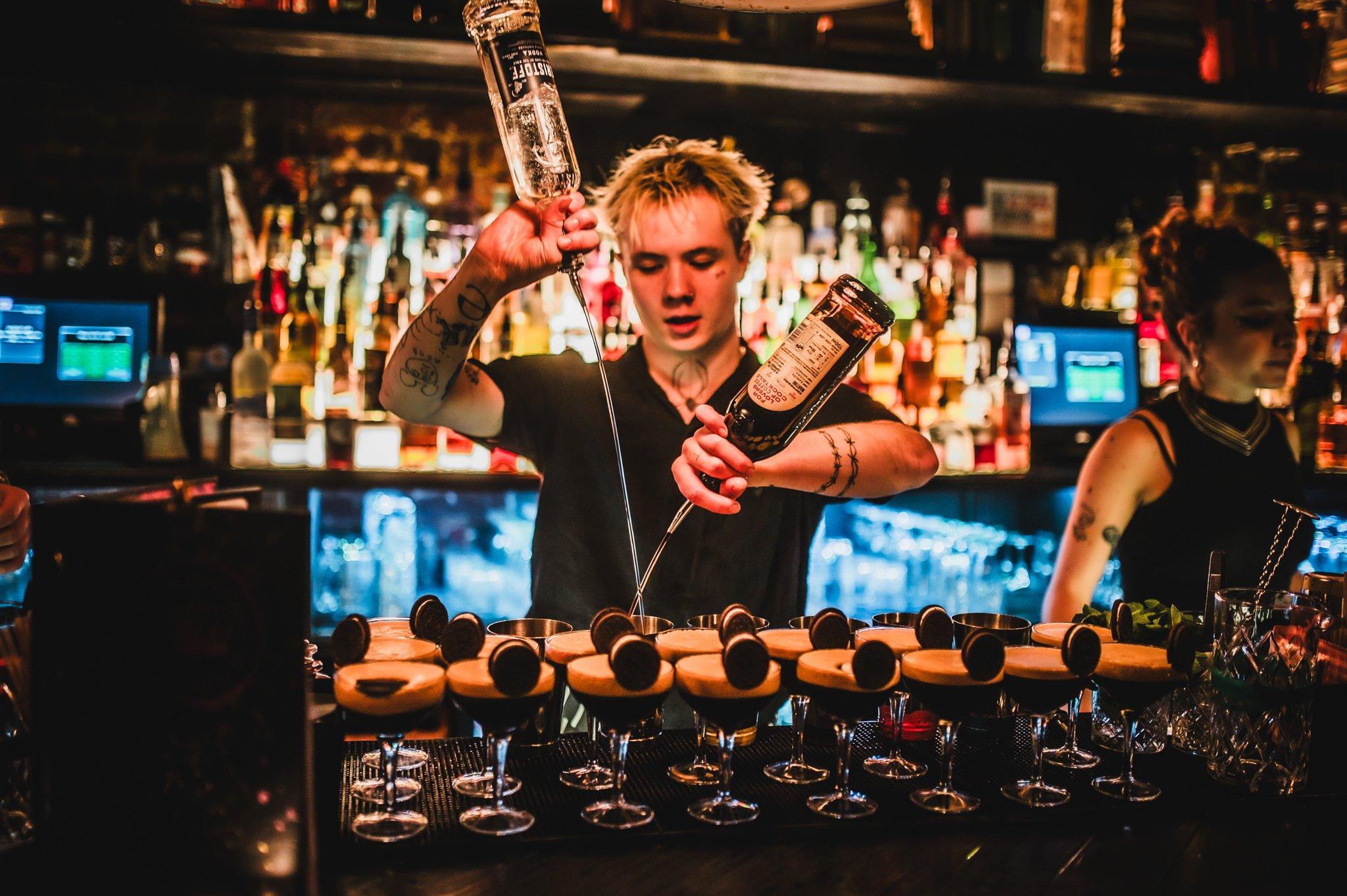 Bartender making Martinis at The Cocktail Club