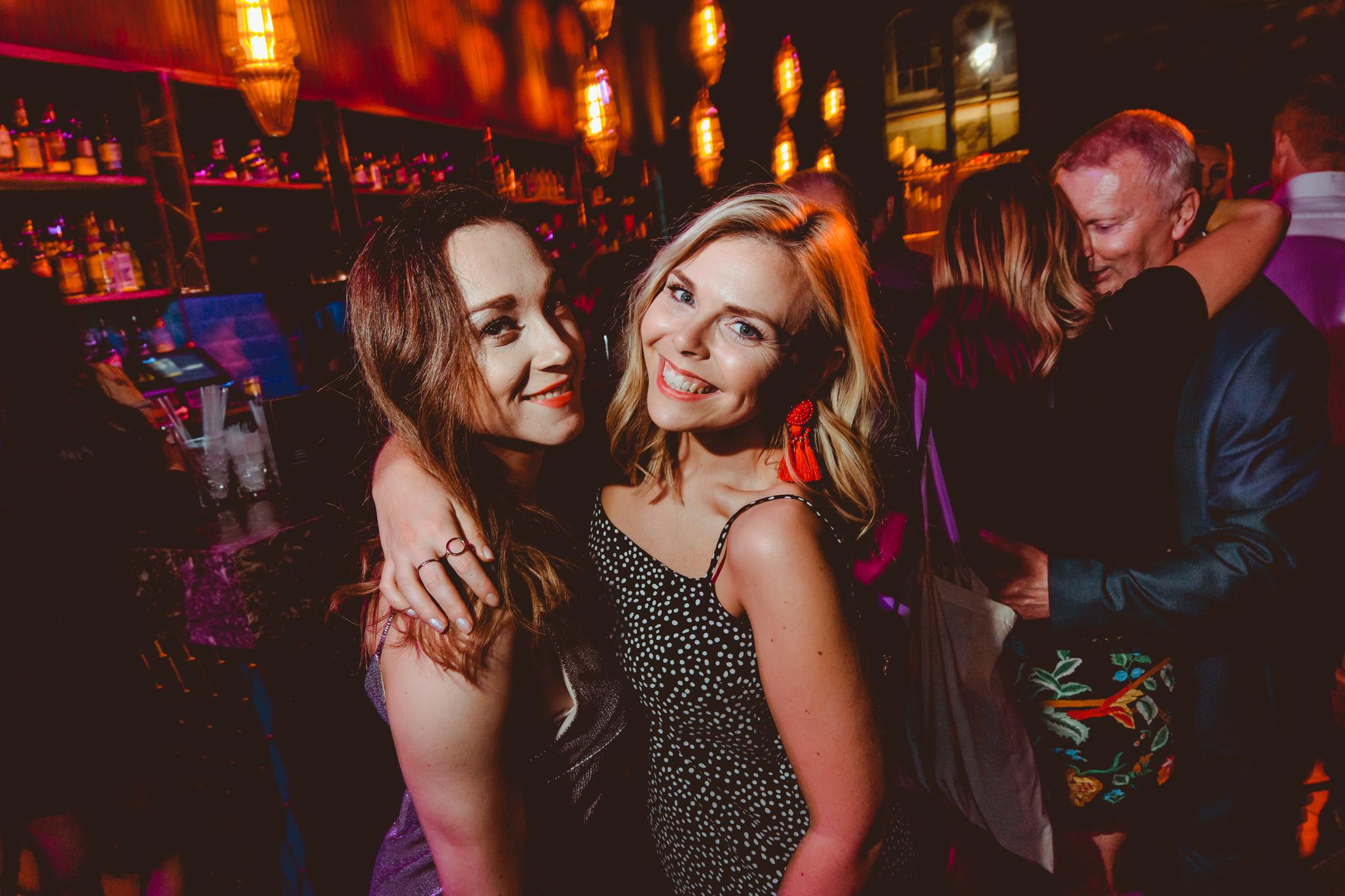 Women posing for a picture in Dirty Martini