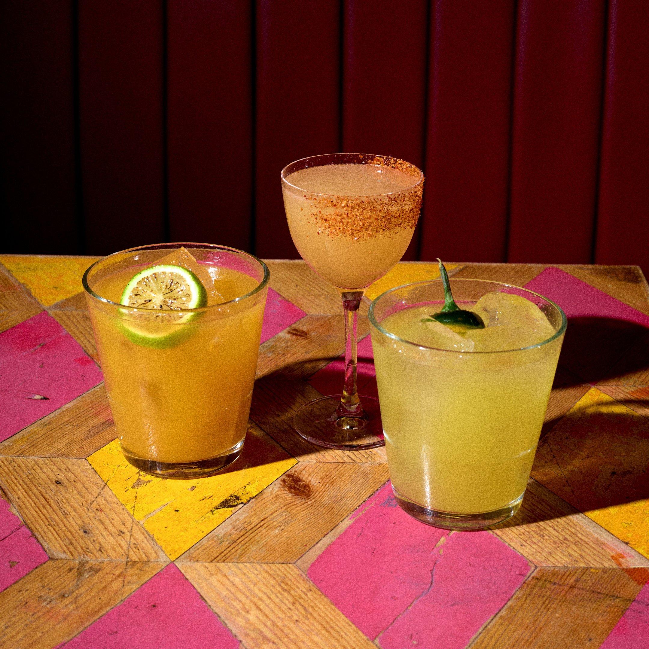 3 spicy margaritas on a table in Barrio