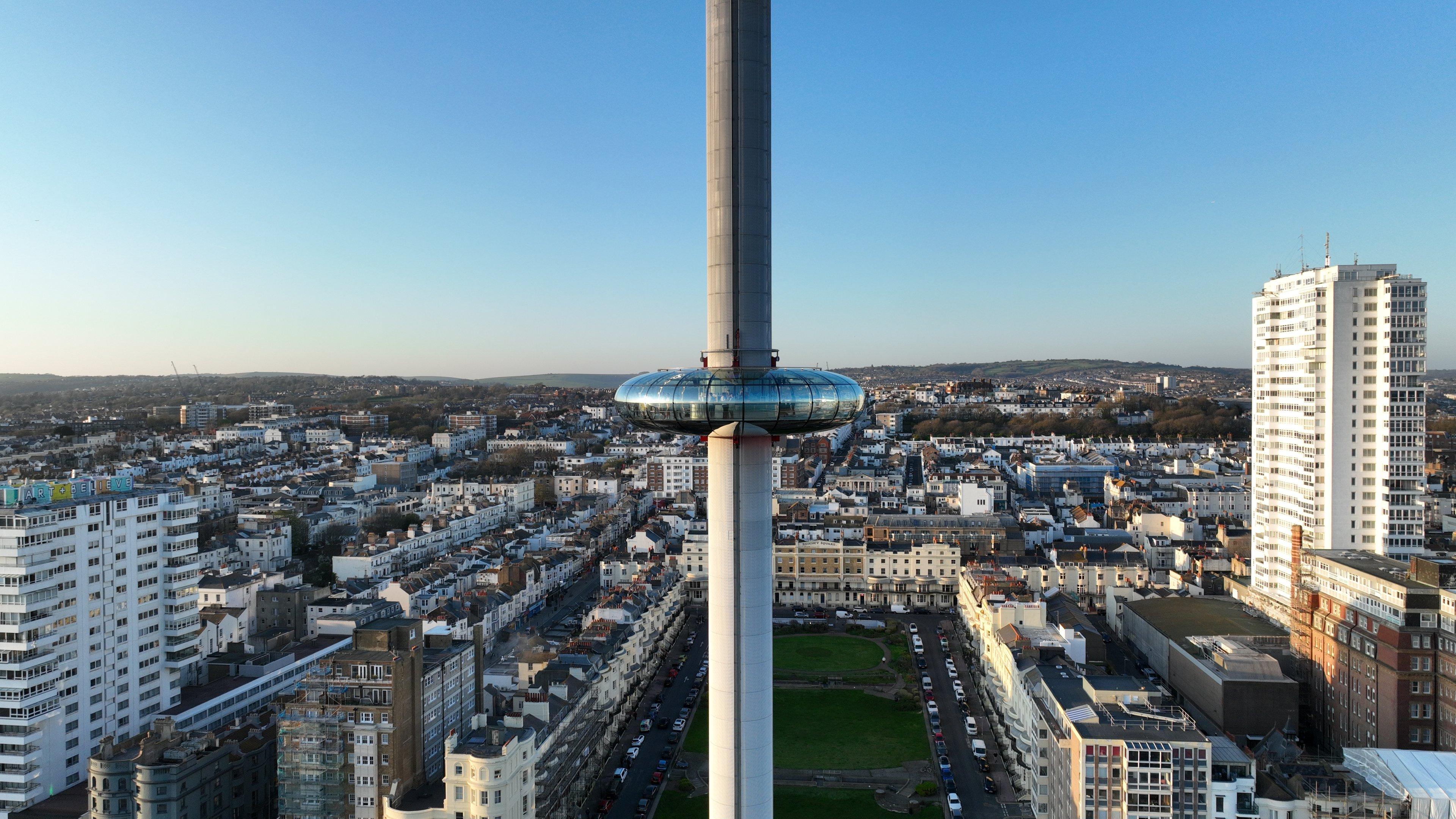 An image of the Brighton i360 tower with Brighton in the background