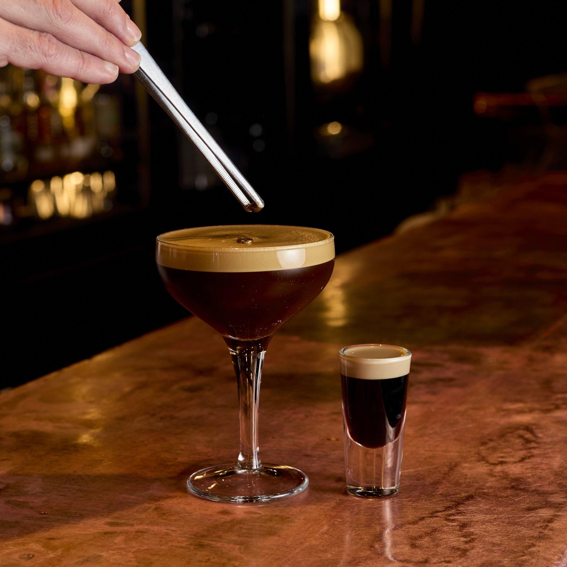 An image of an Espresso Martini being garnished and a baby Guinness shot on a bar in the Escapologist