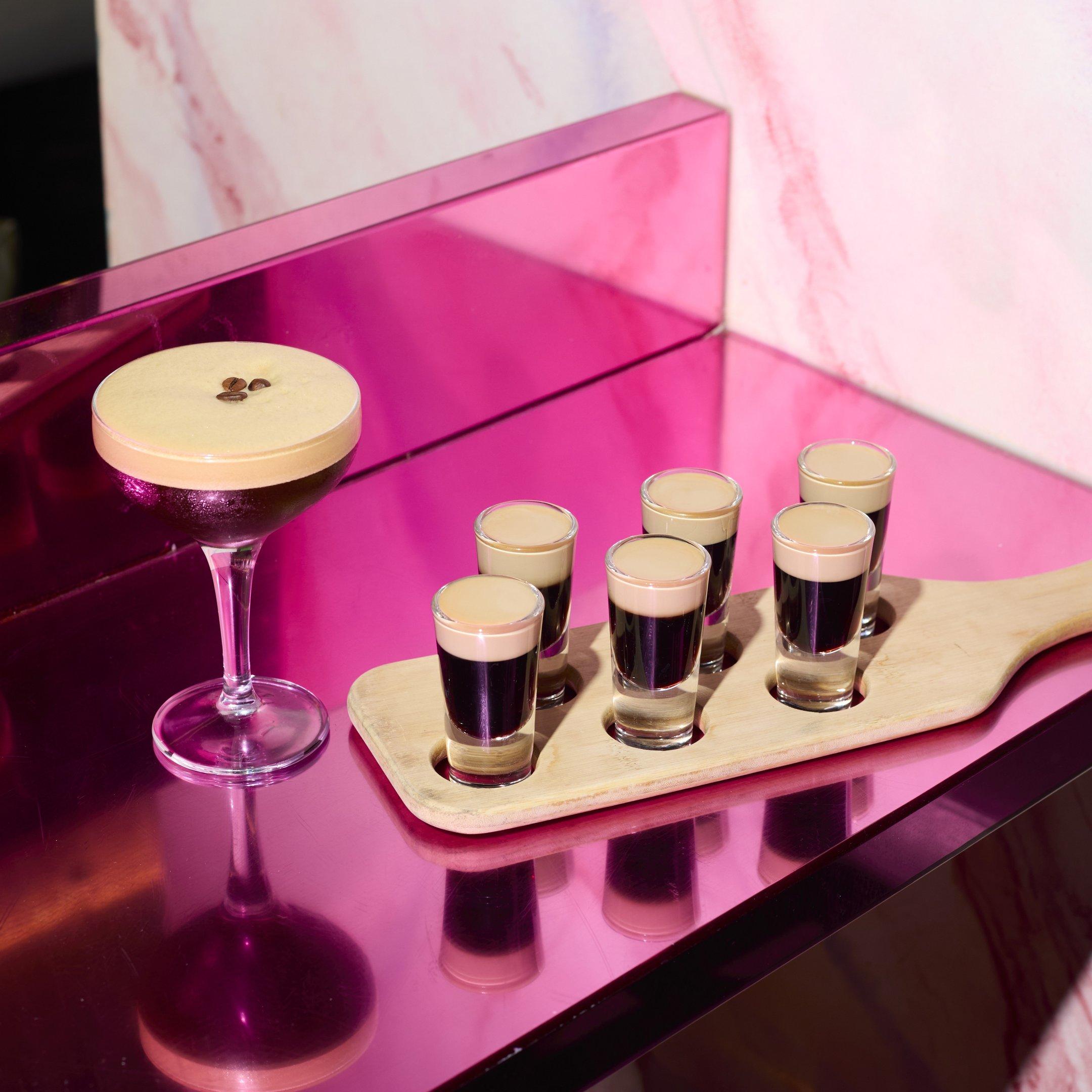 An Espresso Martini cocktail and Baby Guinness shot paddle on a table in Tonight Josephone