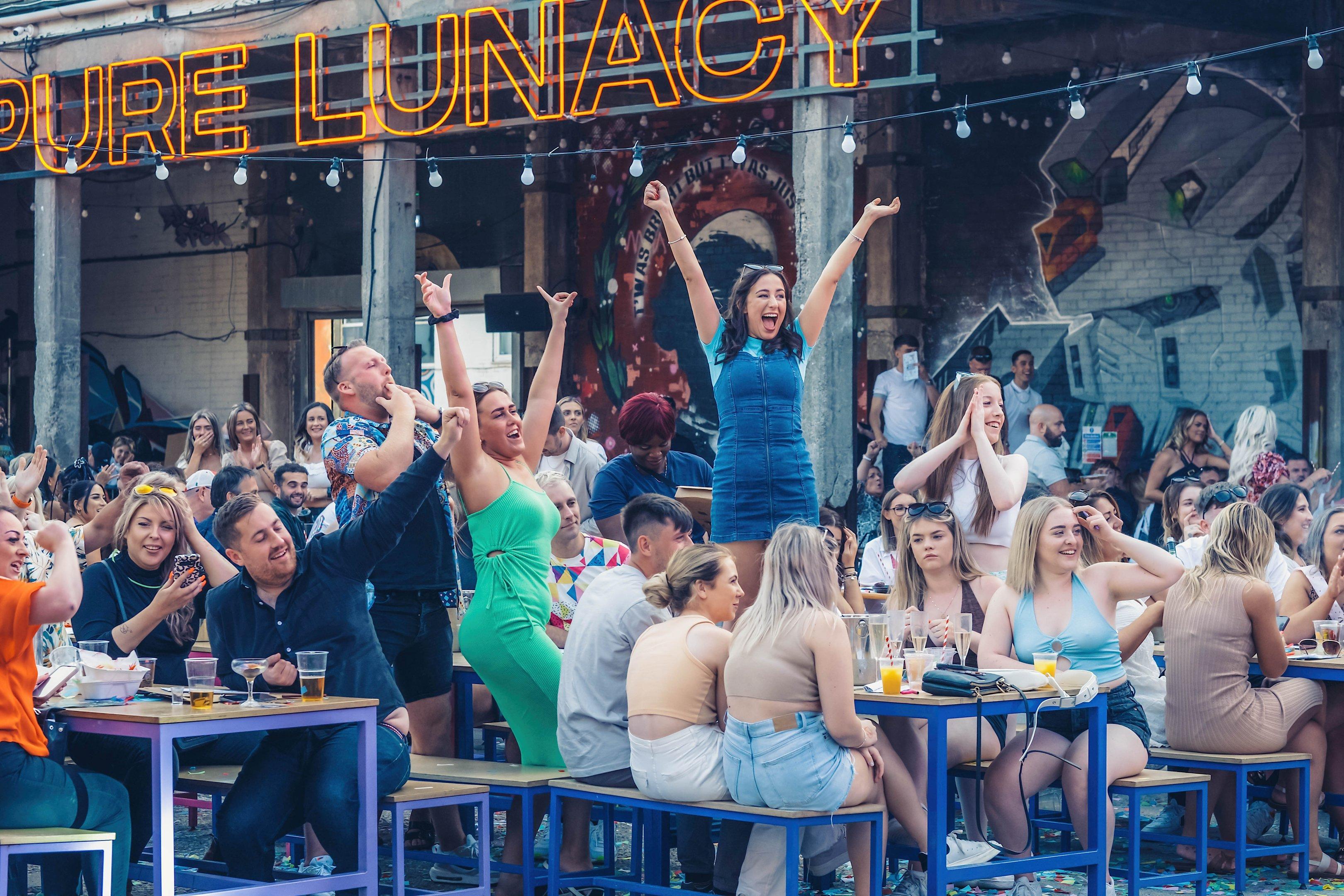 Guests dancing and enjoying brunch in Luna Springs