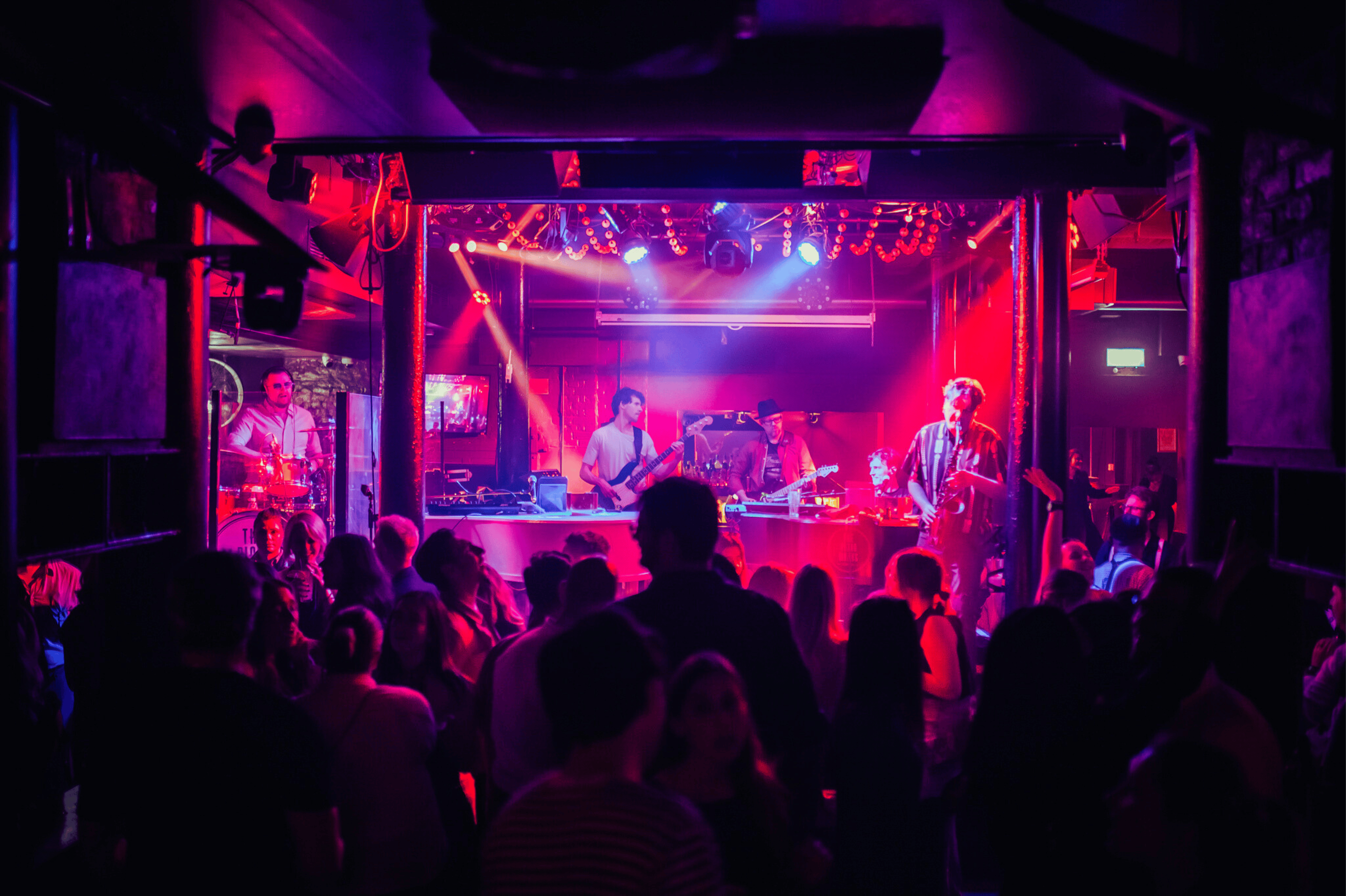 An image of a band on a stage in The Piano Works with an audience