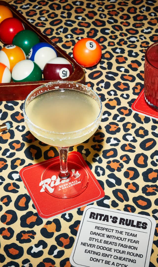 Rita's margs on leopard print pool table
