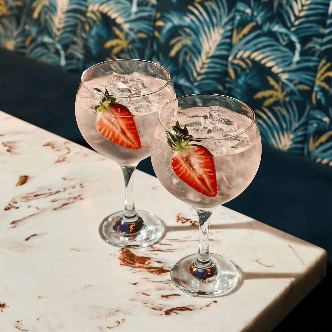 2 pink gin spritzes on table