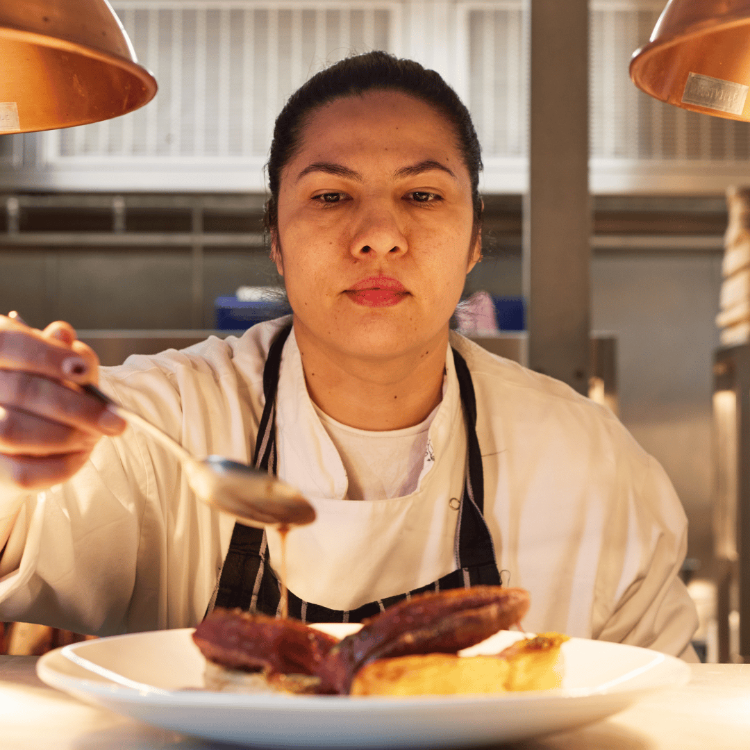 Chef preparing duck at The Chapter Collection
