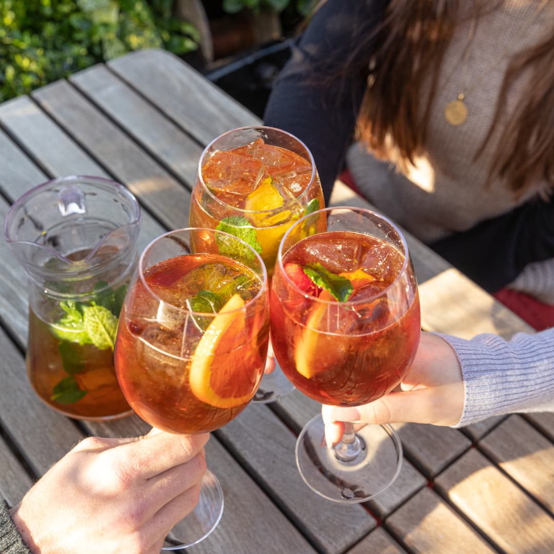 cocktail wine glasses filled with Pimm's spritz cocktail
