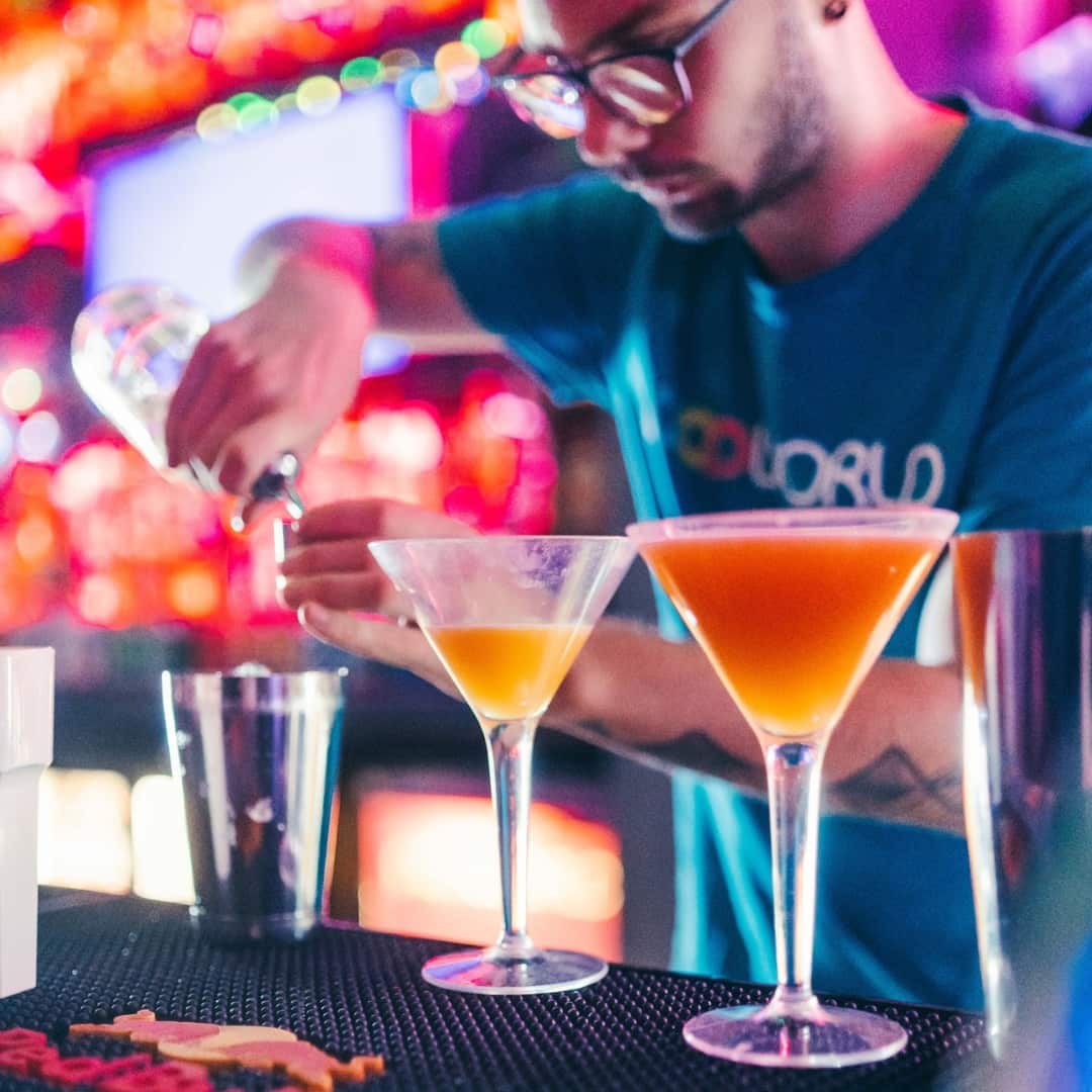 Popworld bartender making Pornstar Martinis