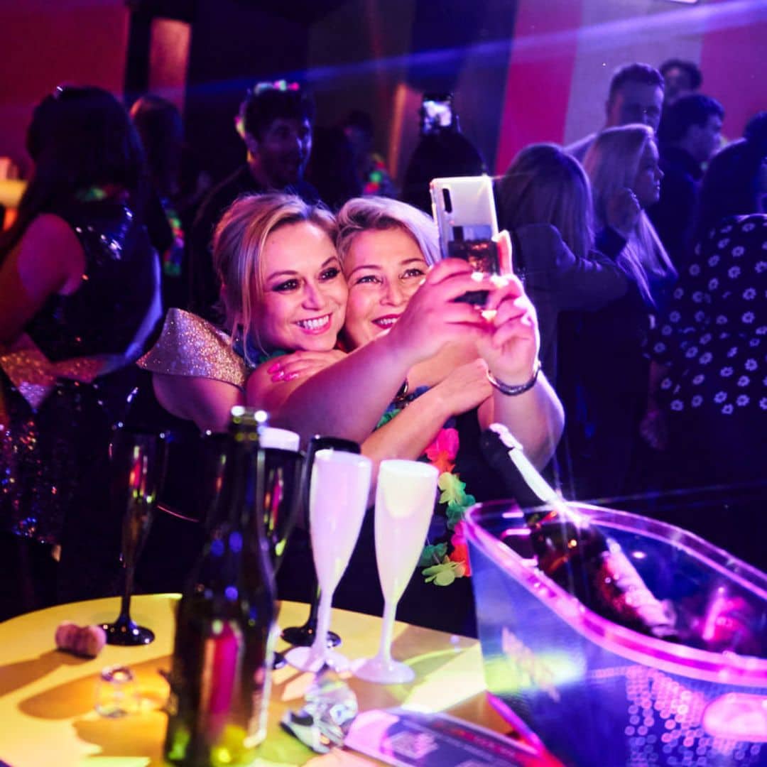 Two Popworld guests taking a photo