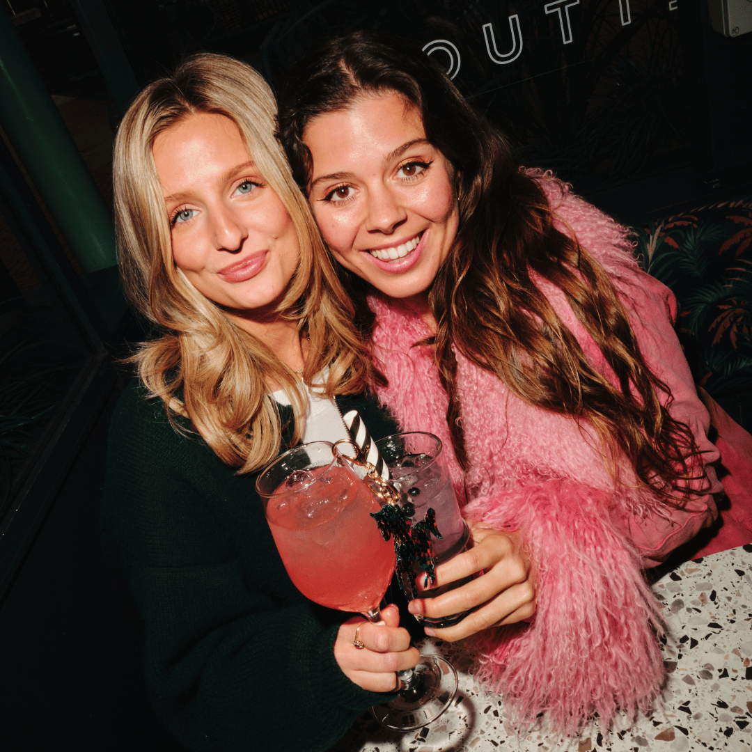 2 friends enjoying cocktails at Slug & Lettuce