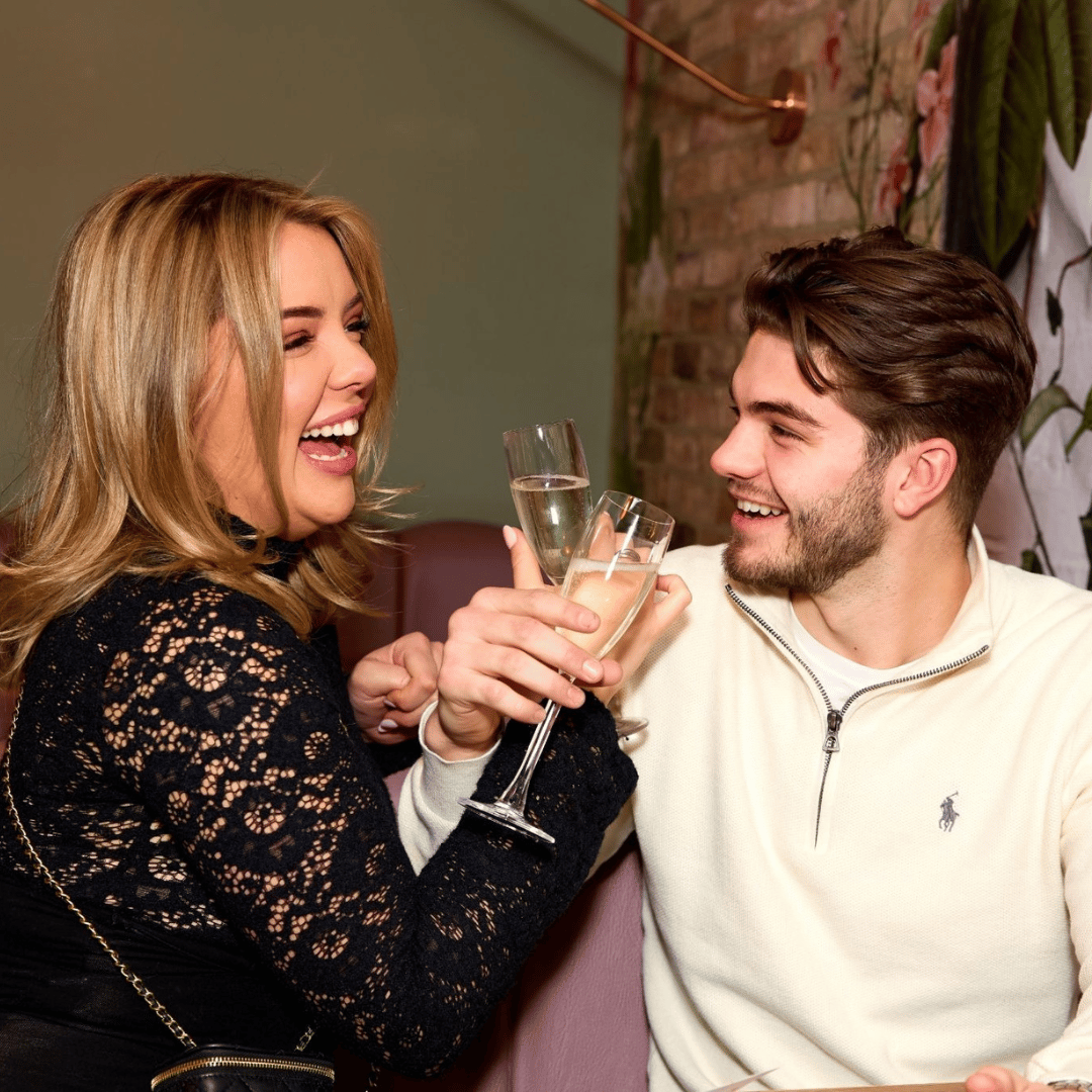 Couple toasting prosecco at Slug & Lettuce
