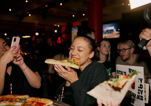 Biting Rita's XL Pizza Slice