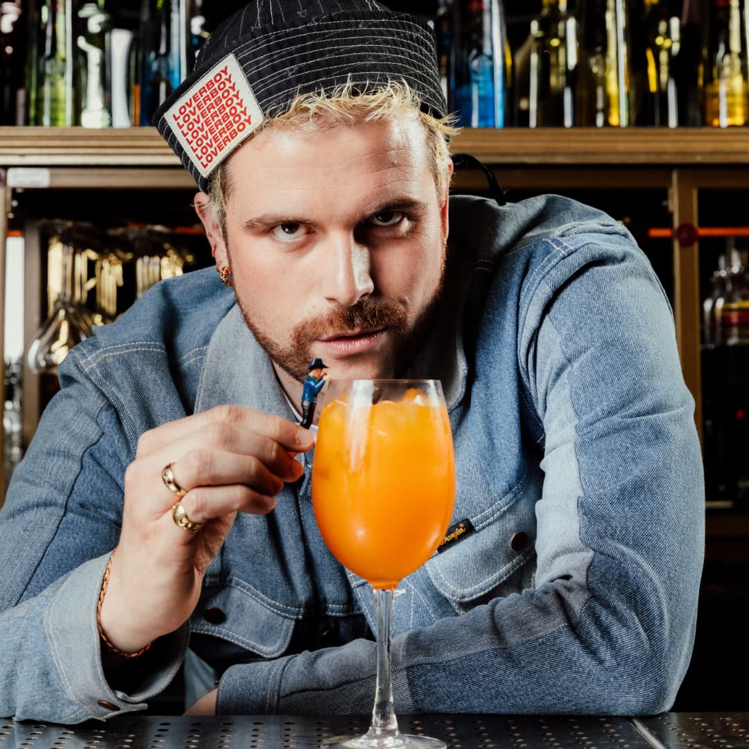 Reece D'vey with Pride cocktail
