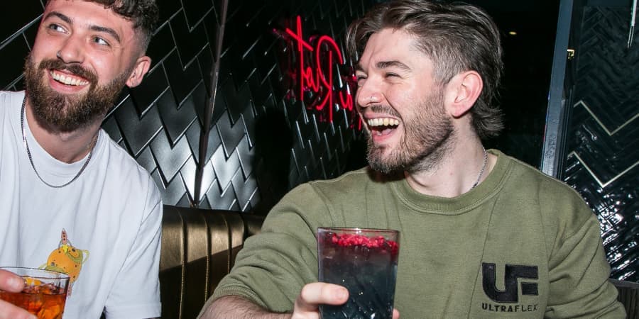 Friends enjoying 2 for 1 cocktails at Be At One