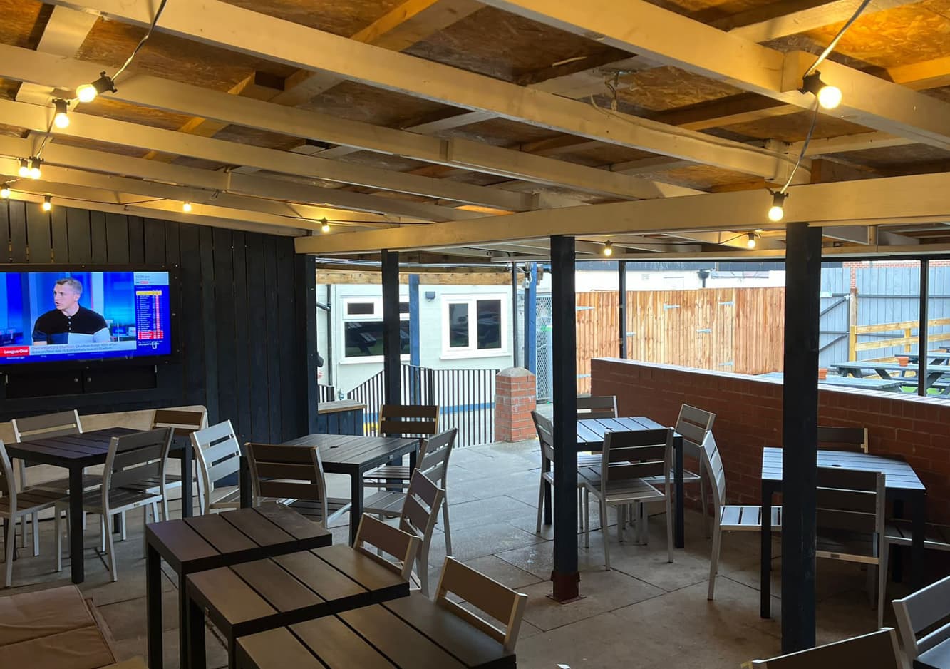 outdoor covered seating and outdoor TV at the Britannia